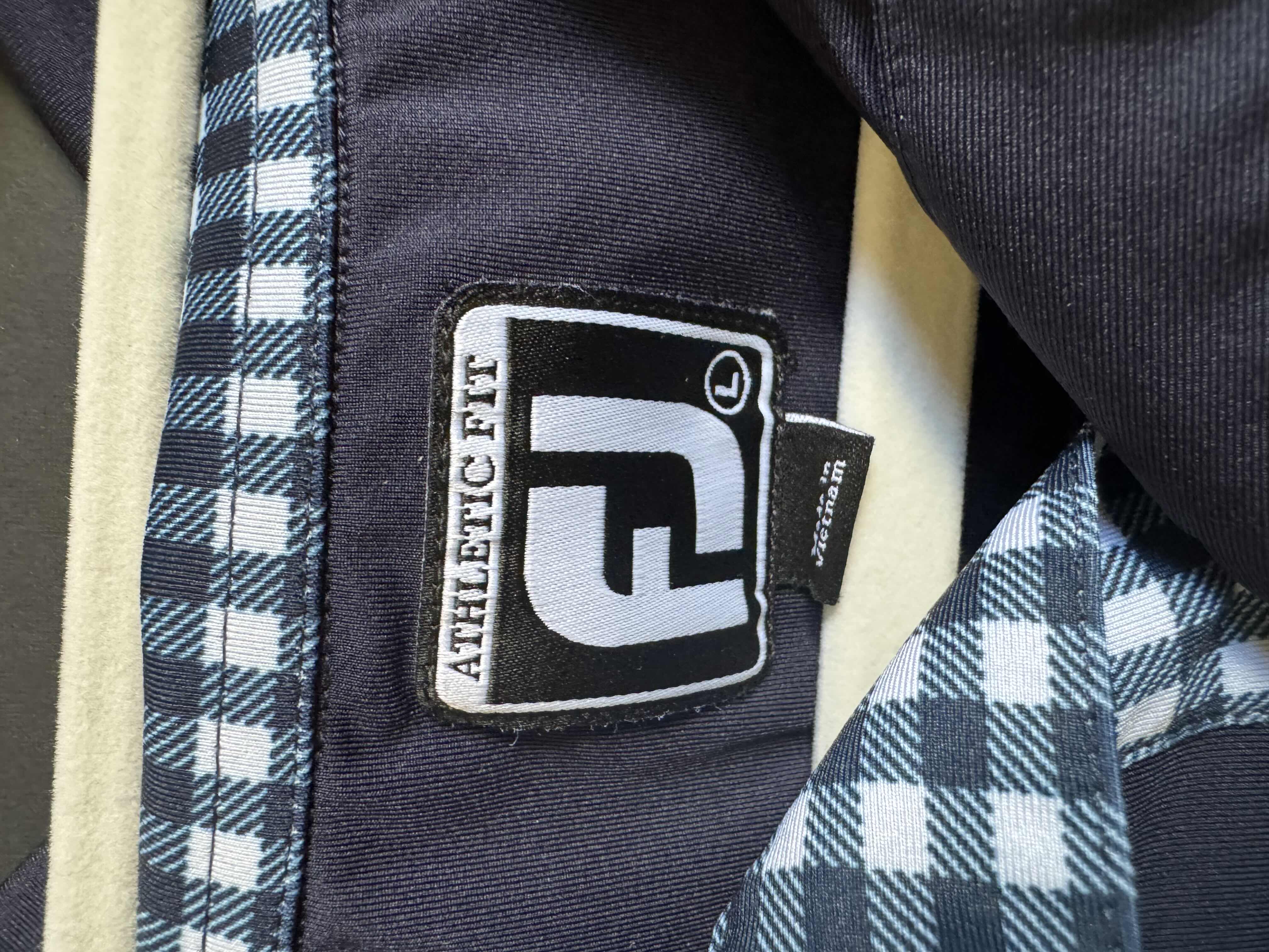 Photo 1 of FJ MENS SIZE LARGE PGA TOUR PATCHED POLO- ONLY FOR TOUR PROS AND NOT AVAILABLE TO THE PUBLIC