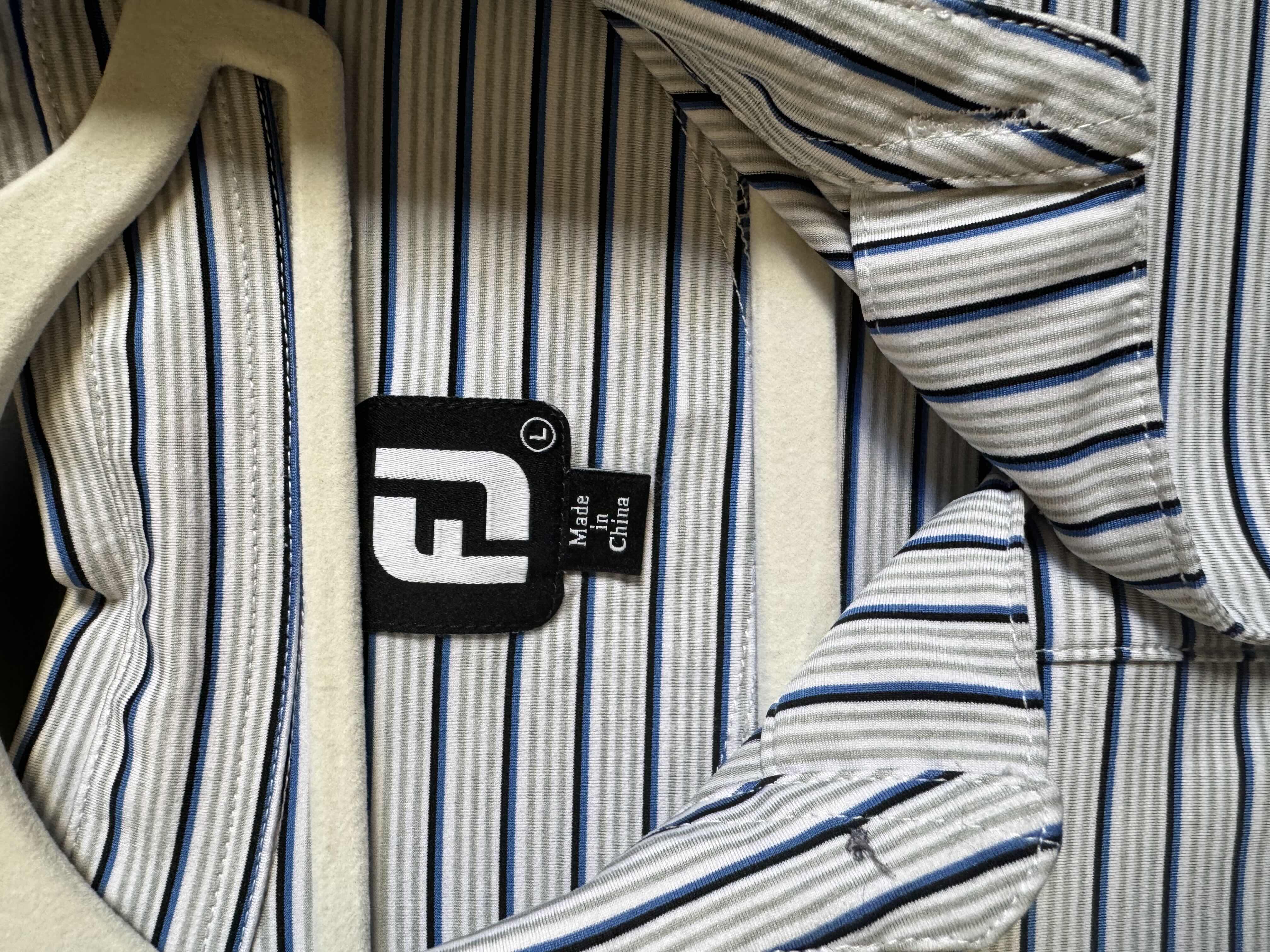 Photo 1 of FJ MENS SIZE LARGE PGA TOUR PATCHED POLO- ONLY FOR TOUR PROS AND NOT AVAILABLE TO THE PUBLIC