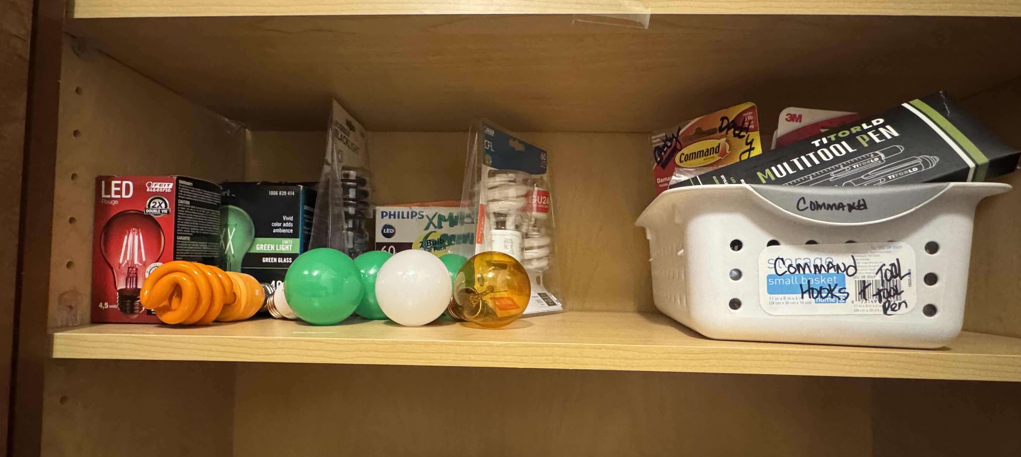 Photo 1 of CONTENTS OF SHELF-LIGHT BULBS AND COMMAND HOOKS