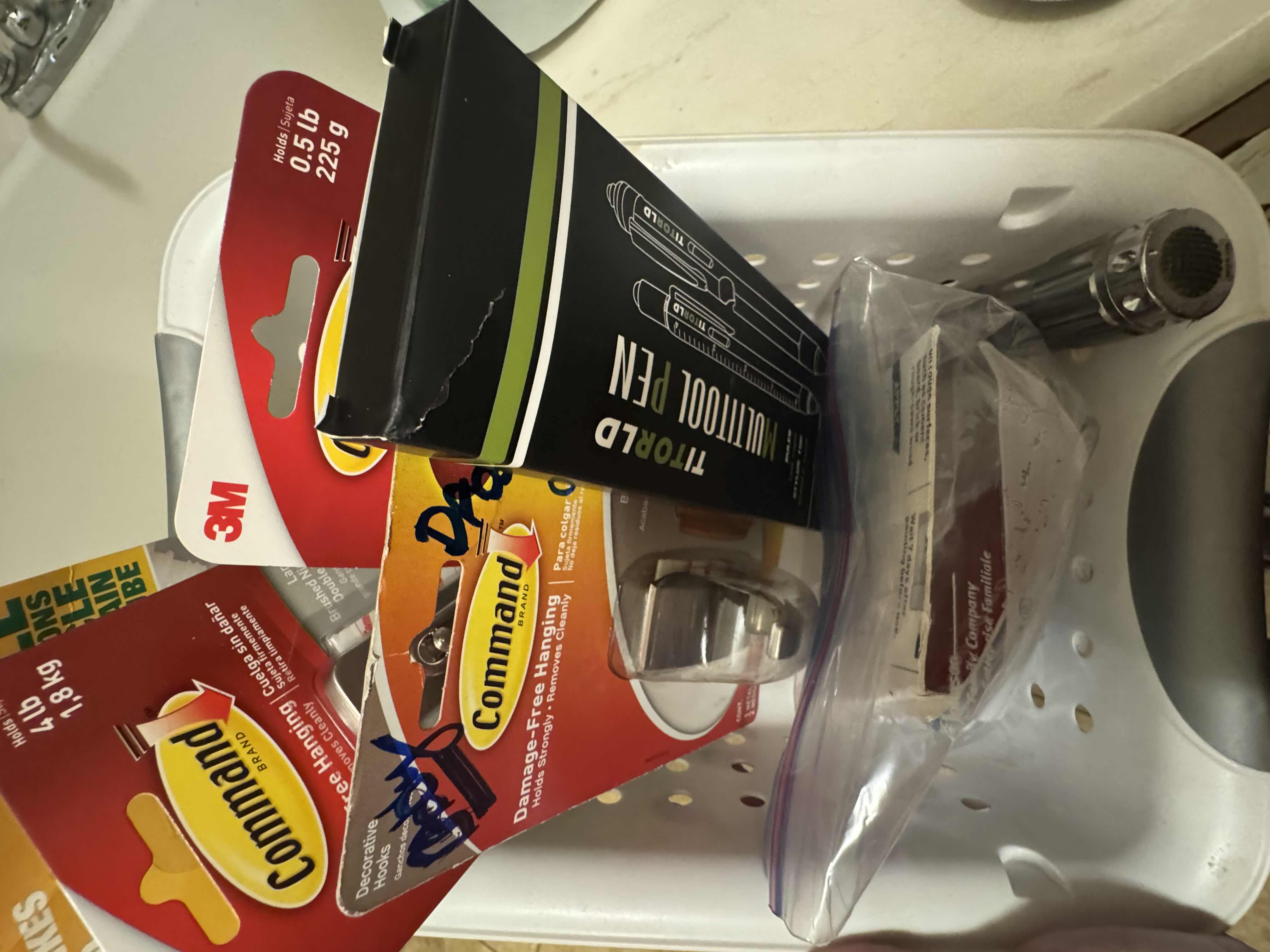 Photo 1 of CONTENTS OF SHELF-LIGHT BULBS AND COMMAND HOOKS