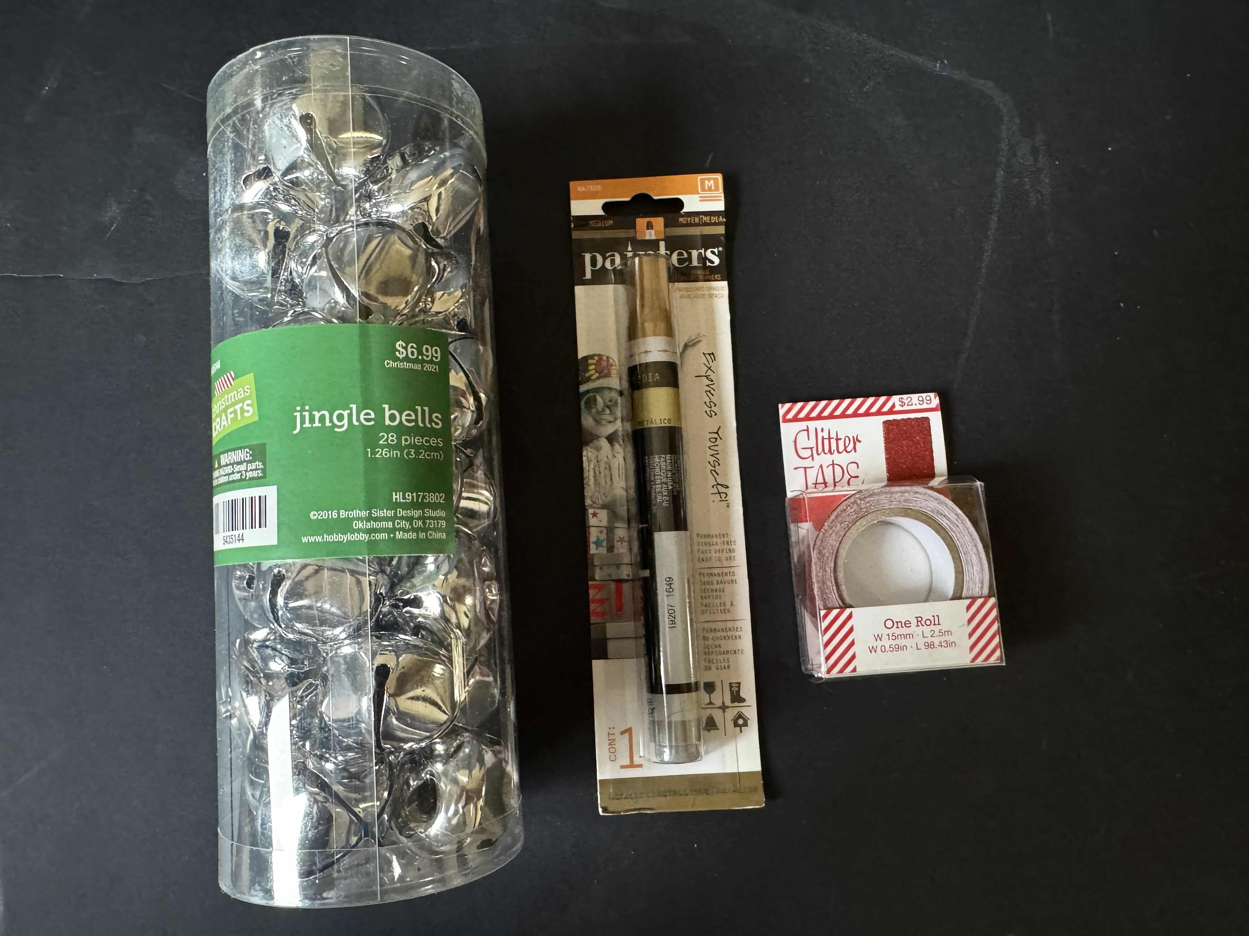 Photo 1 of ASSORTED HOLIDAY DECOR, CHRISTMAS DECOR, CERAMIC POINSETTIA CHRISTMAS TREE, 2 HANDSOAP, CANDLE, JINGLE BELLS, PAINT MARKER, ONE ROLL GLITTER TAPE