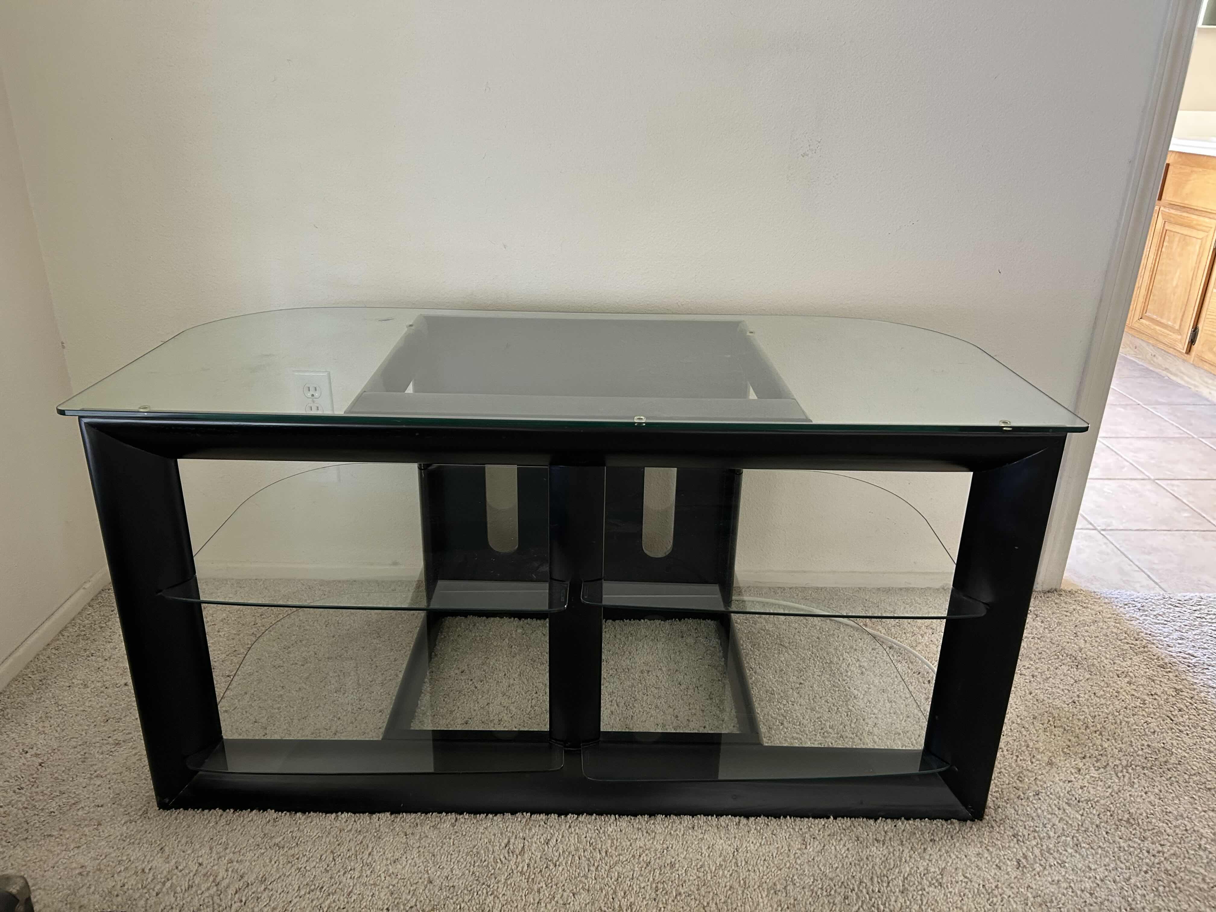 Photo 1 of BLACK AND GLASS ENTERTAINMENT CENTER 48” X 22” H 24”