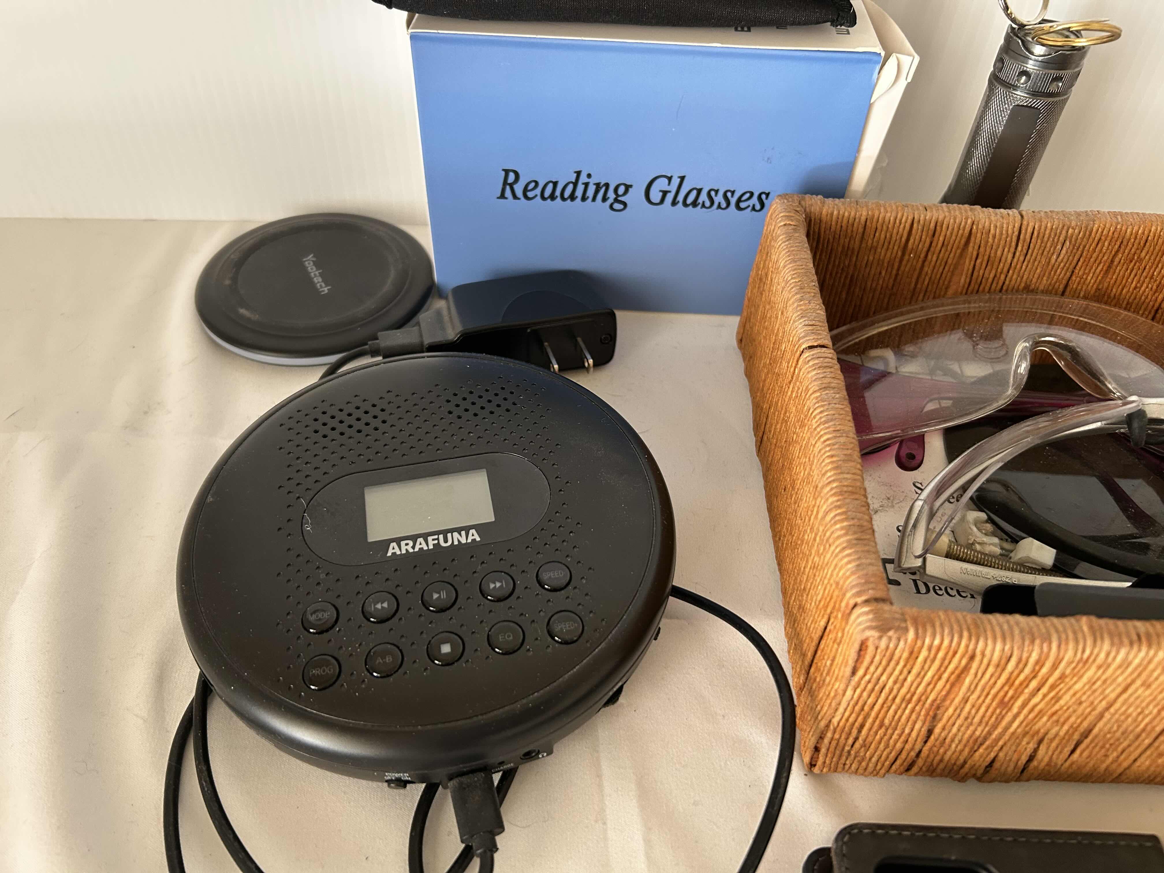 Photo 1 of ASSORTED ITEMS,READING GLASSES, PORTABLE CD PLAYER, IPHONE CASES.