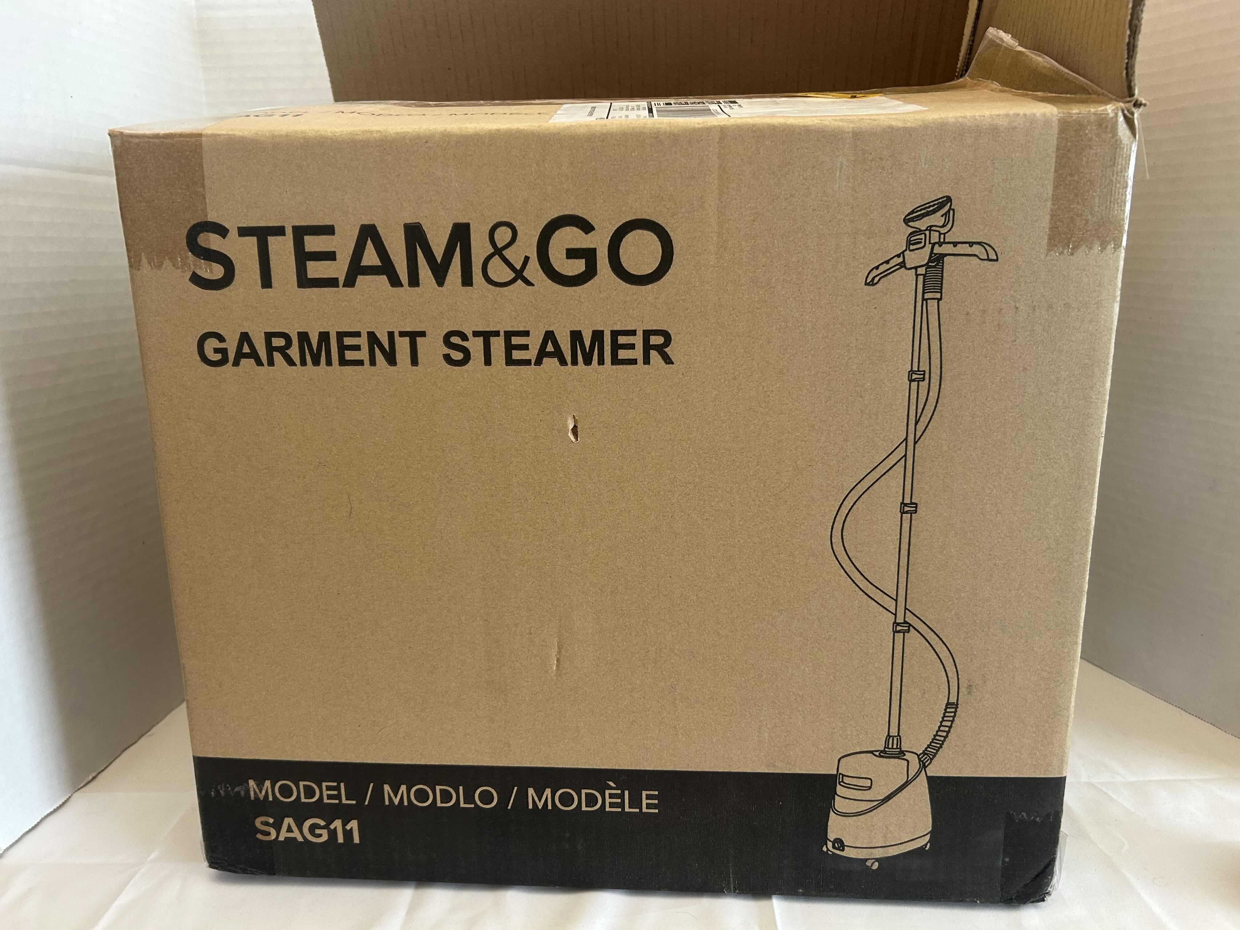 Photo 1 of BRAND NEW-STEAM & GO GARMENT STEAMER. MODEL SAG11