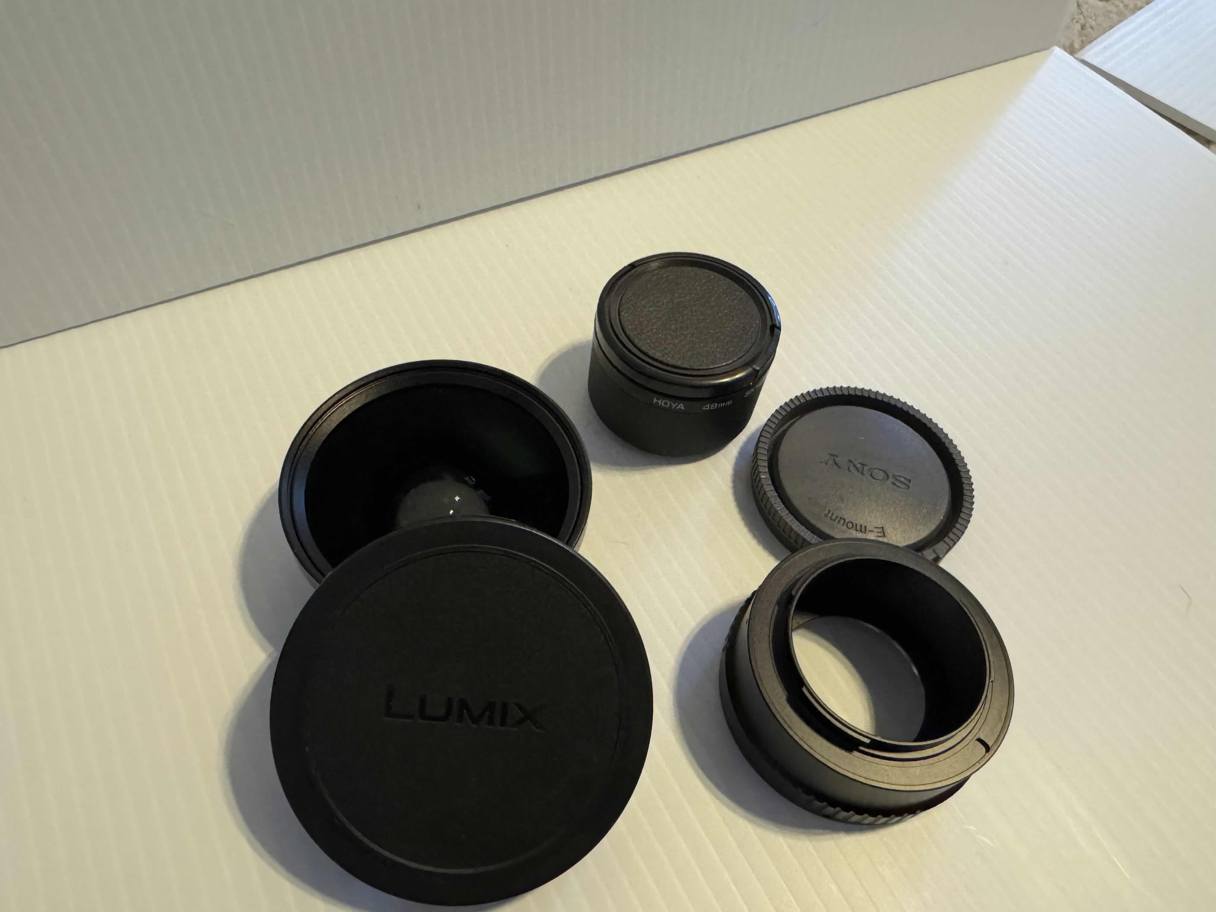 Photo 1 of ASSORTED CAMERA LENS COVERS