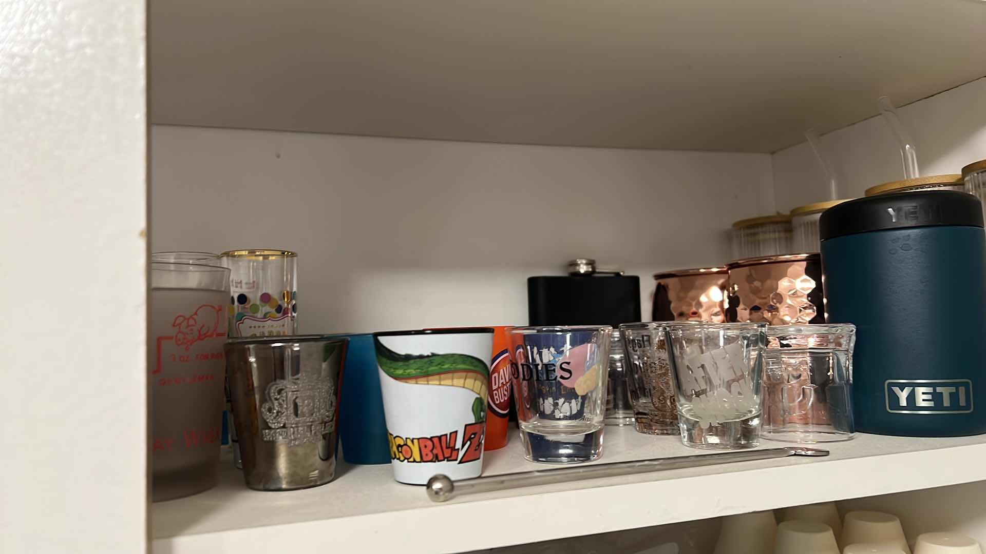 Photo 1 of CONTENTS OF SHELF. SHOT GLASSES