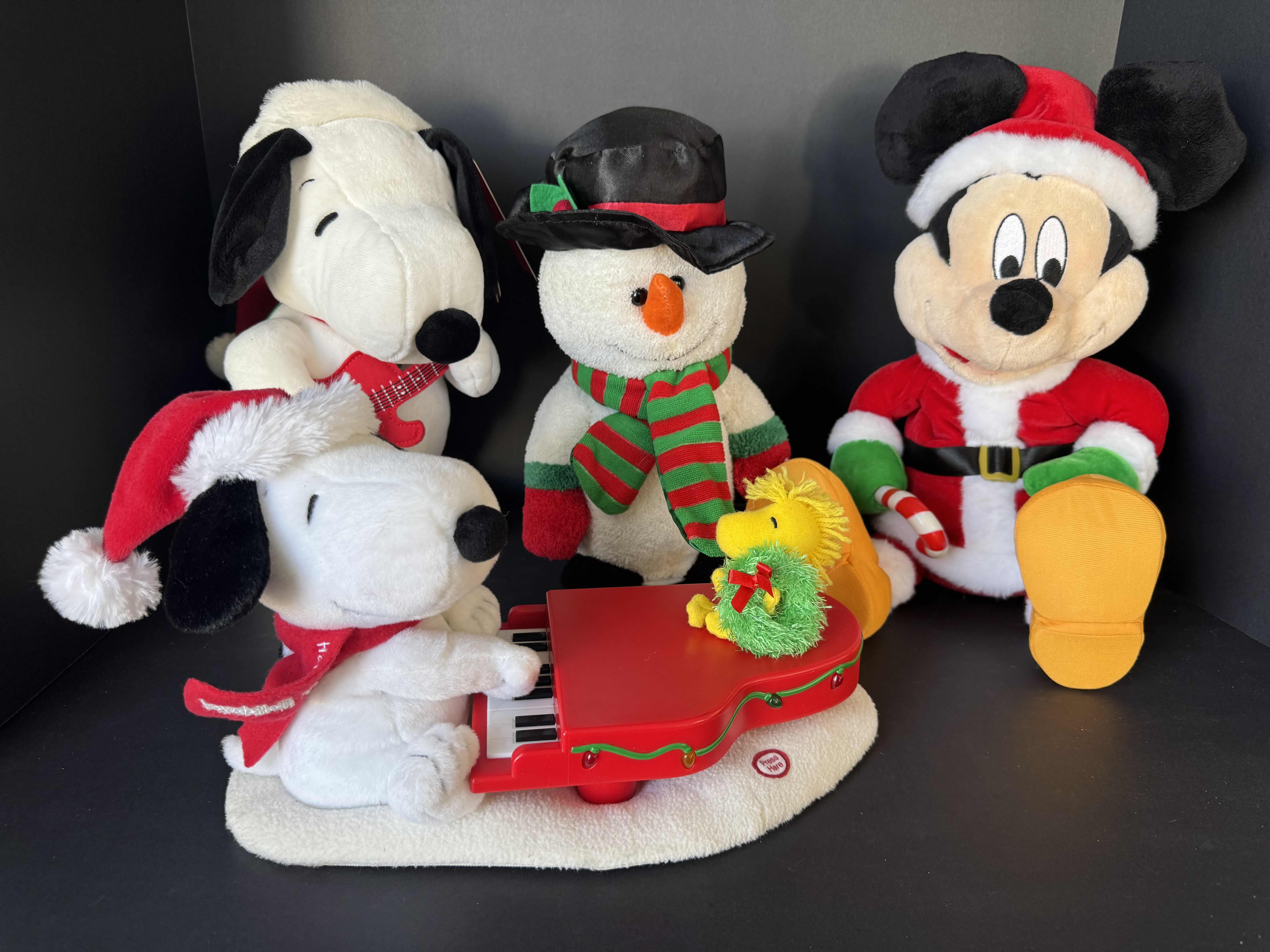 Photo 1 of ASSORTED HOLIDAY PLUSHIES-DISNEY, AND PEANUTS. CHRISTMAS DECOR.