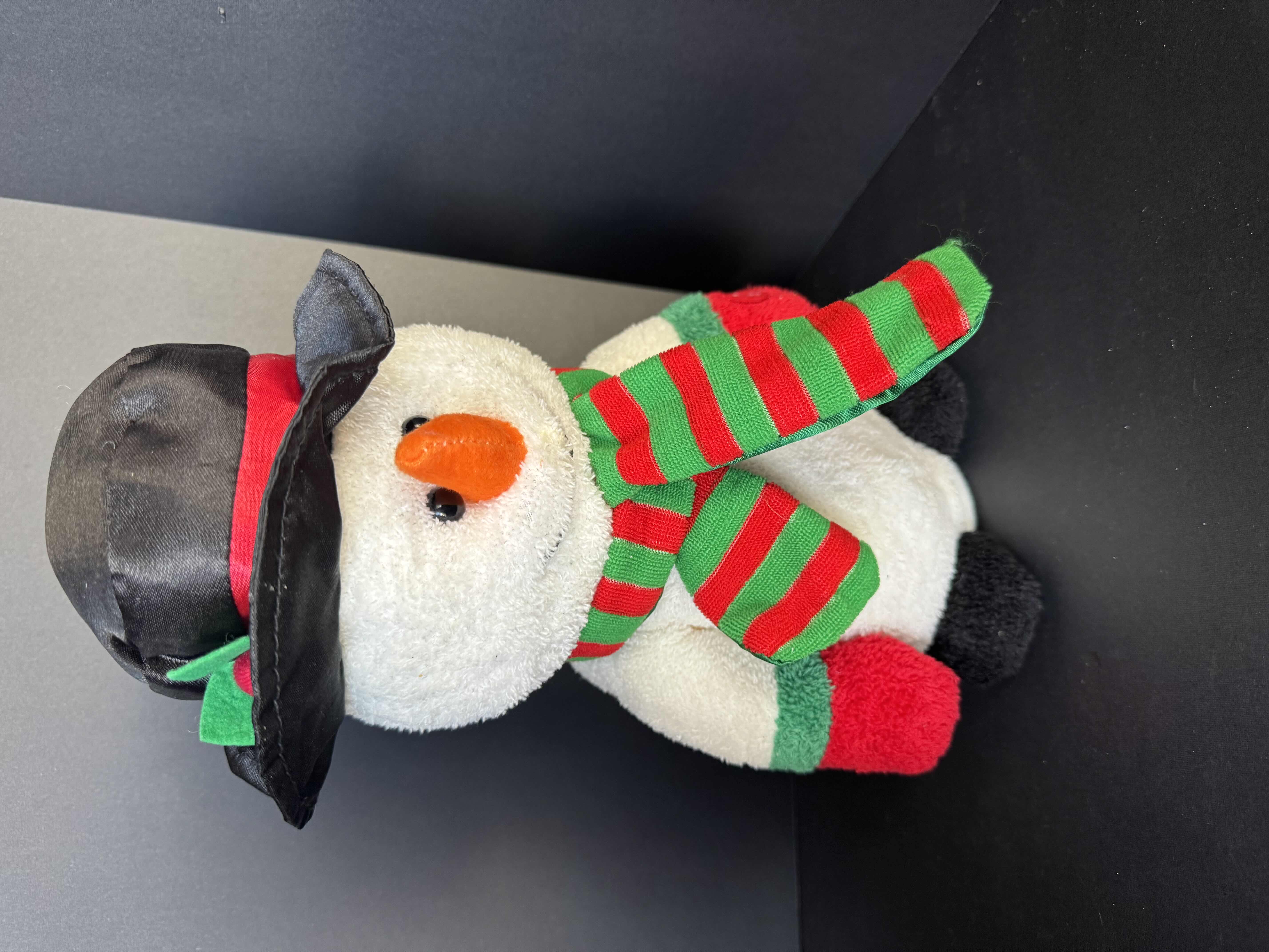 Photo 1 of ASSORTED HOLIDAY PLUSHIES-DISNEY, AND PEANUTS. CHRISTMAS DECOR.