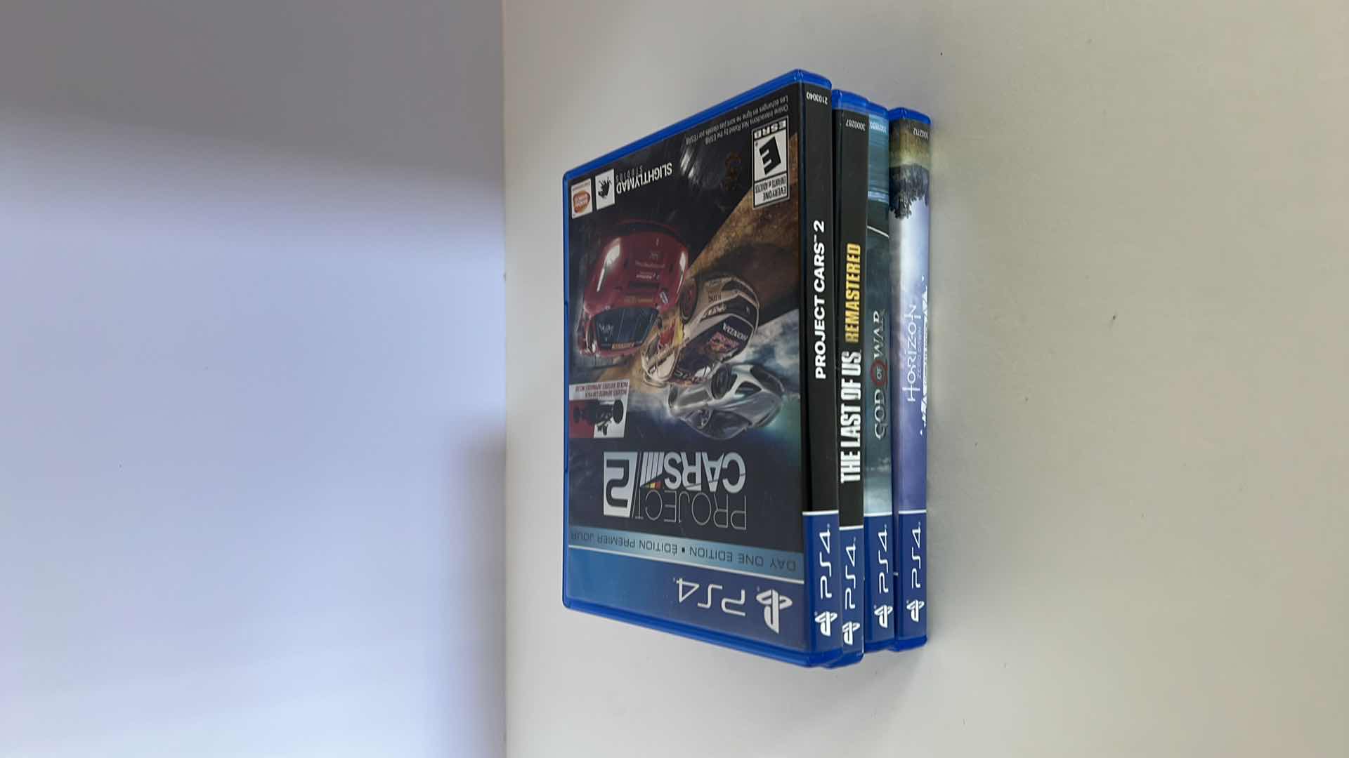 Photo 1 of 4-PS4 GAMES. THE LAST OF US, PROJECT CARS, GOD OF WAR, HORIZON ZERO DAWN.
