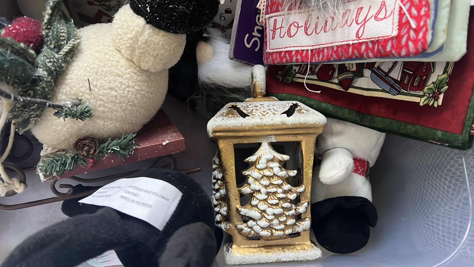 Photo 1 of CONTENTS OF BOX-CHRISTMAS DECOR, ADVENT CALDENDAR, SNOOPY STUFFY, SNOWMAN, AND SOFT CHILDRENS BOOK...ETC..