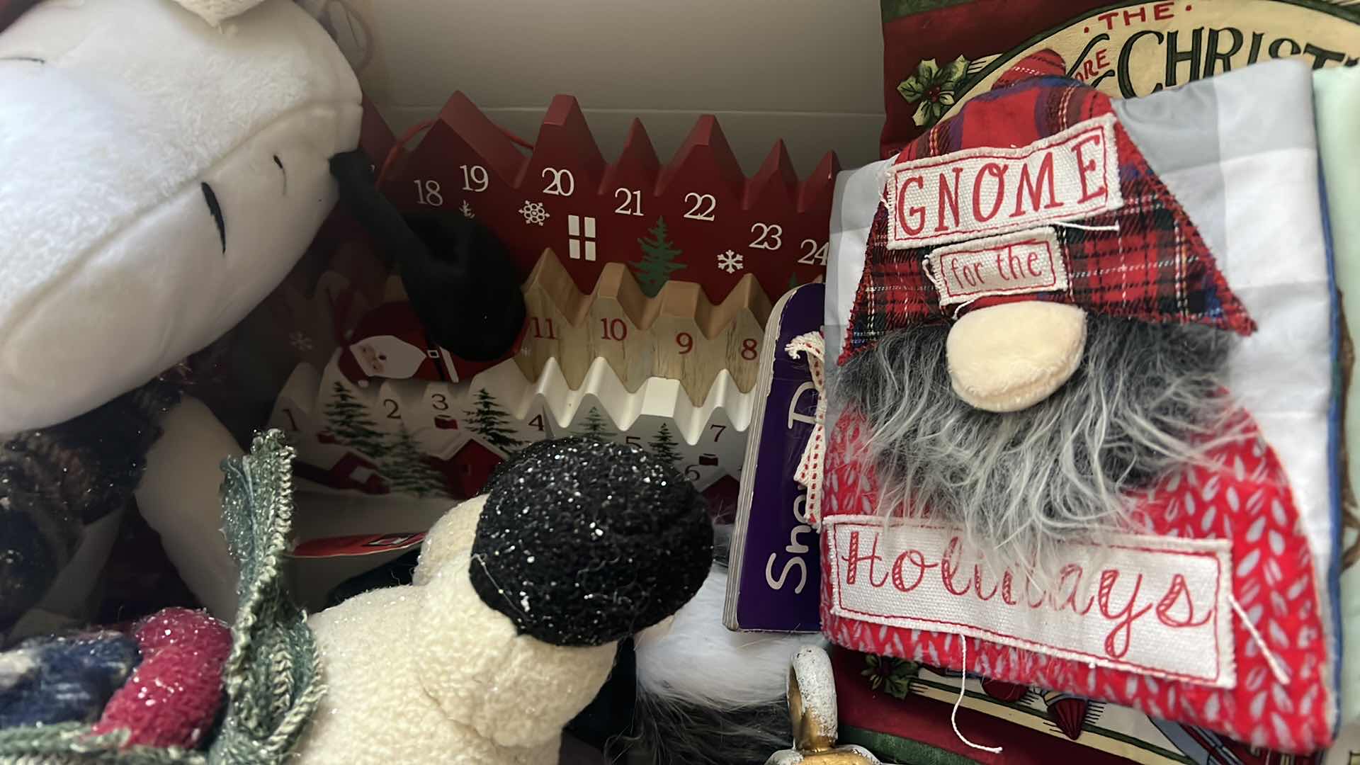 Photo 1 of CONTENTS OF BOX-CHRISTMAS DECOR, ADVENT CALDENDAR, SNOOPY STUFFY, SNOWMAN, AND SOFT CHILDRENS BOOK...ETC..