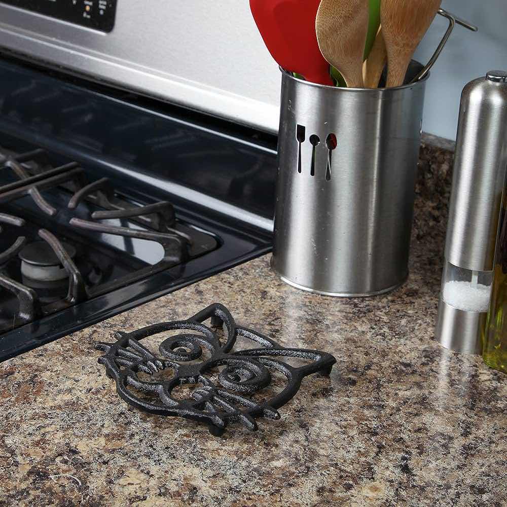 Photo 1 of NEW CASE HOME-X CAT FACE CAST IRON TRIVET 6.5” (CASE OF 24)