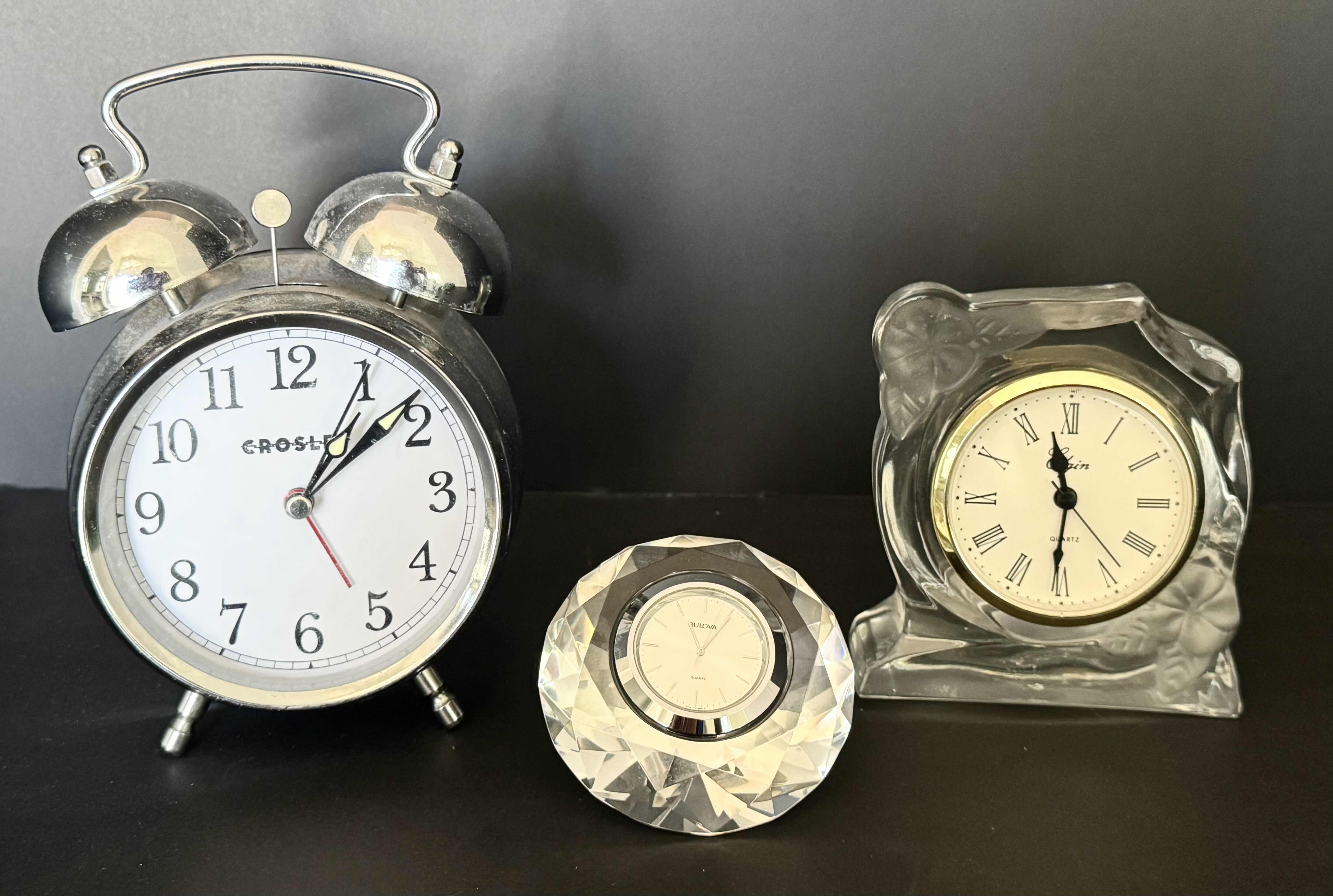 Photo 1 of 3-DESK CLOCKS (HOYA LEAD CRYSTAL SCULPTURE CLOCK BY BULOVA, CROSLEY ANALOG ALARM CLOCK, ELGIN LEAD CRYSTAL GALL QUARTZ CLOCK)