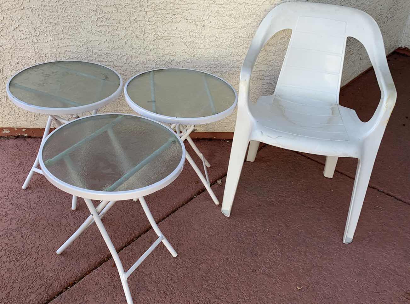 Photo 1 of 3-GLASS TOP PATIO TABLES AND A PLASTIC CHAIR