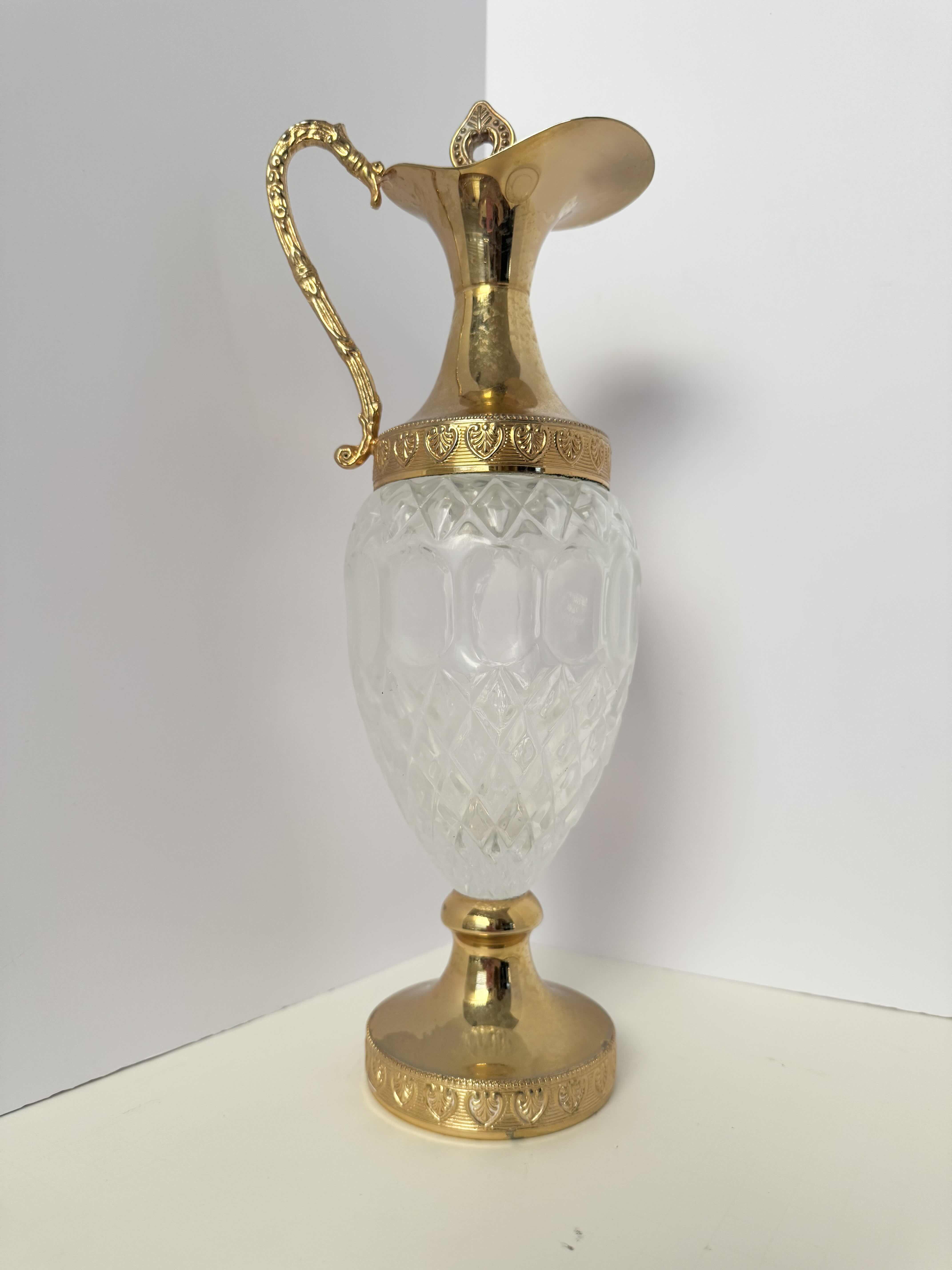 Photo 1 of GLASS PLATE WITH GOLD RIM 13”W,
VINTAGE DECANTER GOLD TONES 13”H