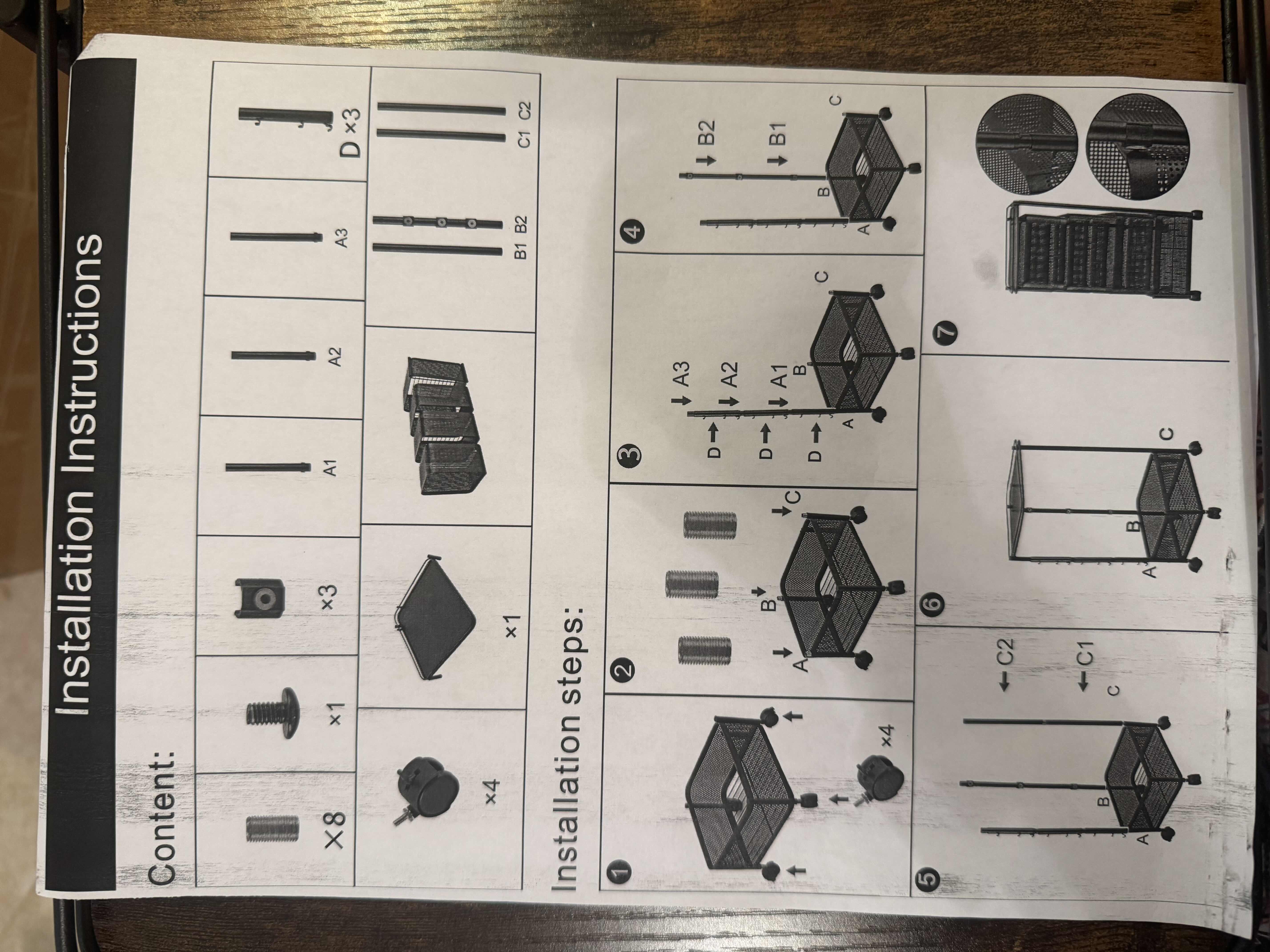 Photo 1 of 2 BRAND NEW FRUIT BASKET STORAGE UNITS, BOTH BLACK AND METAL, ONE IS SQUARE & ONE IS ROUND. NEEDS ASSEMBLED