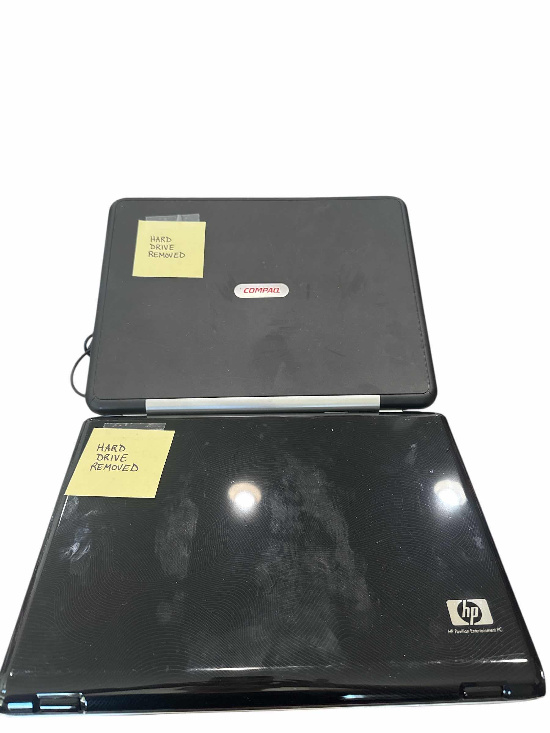 Photo 1 of 2 LAPTOPS: 1) HP & 1) COMPAQ. POWER CORDS INCLUDED, HARD DRIVES REMOVED