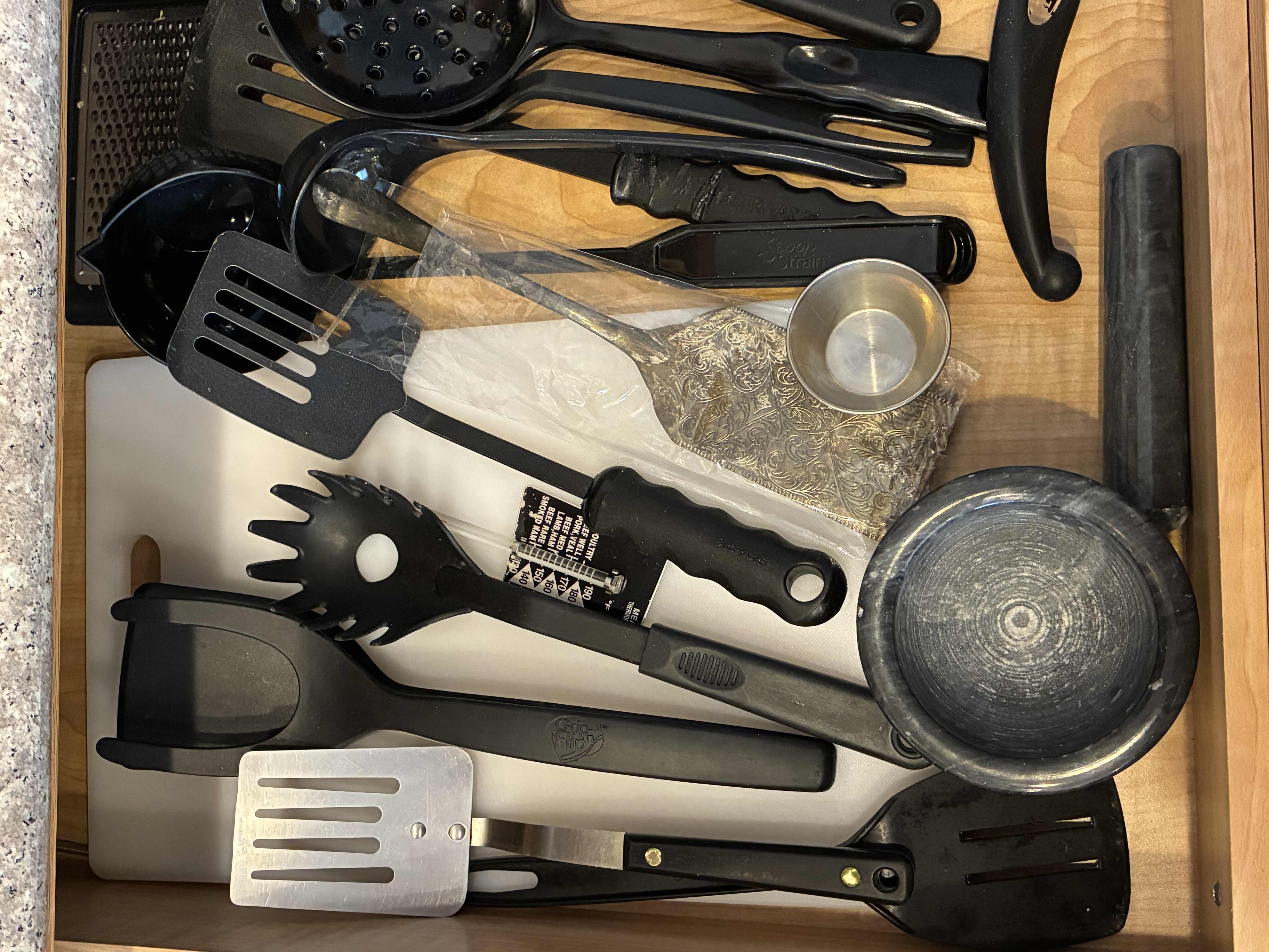 Photo 1 of CONTENTS OF DRAWER -KITCHEN UTENSILS & CUTLERY W CUTTING BOARD