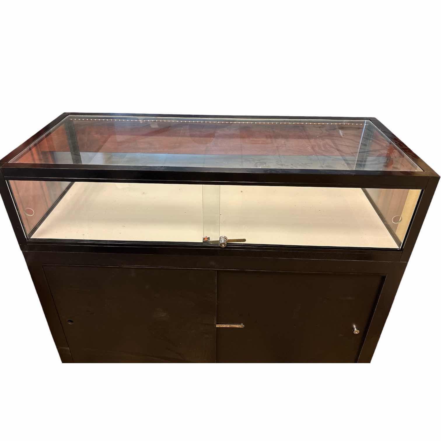 Photo 1 of QUARTER VISION BLACK GLASS DISPLAY COUNTER (SEE NOTES) 49.5”X20”H42”
