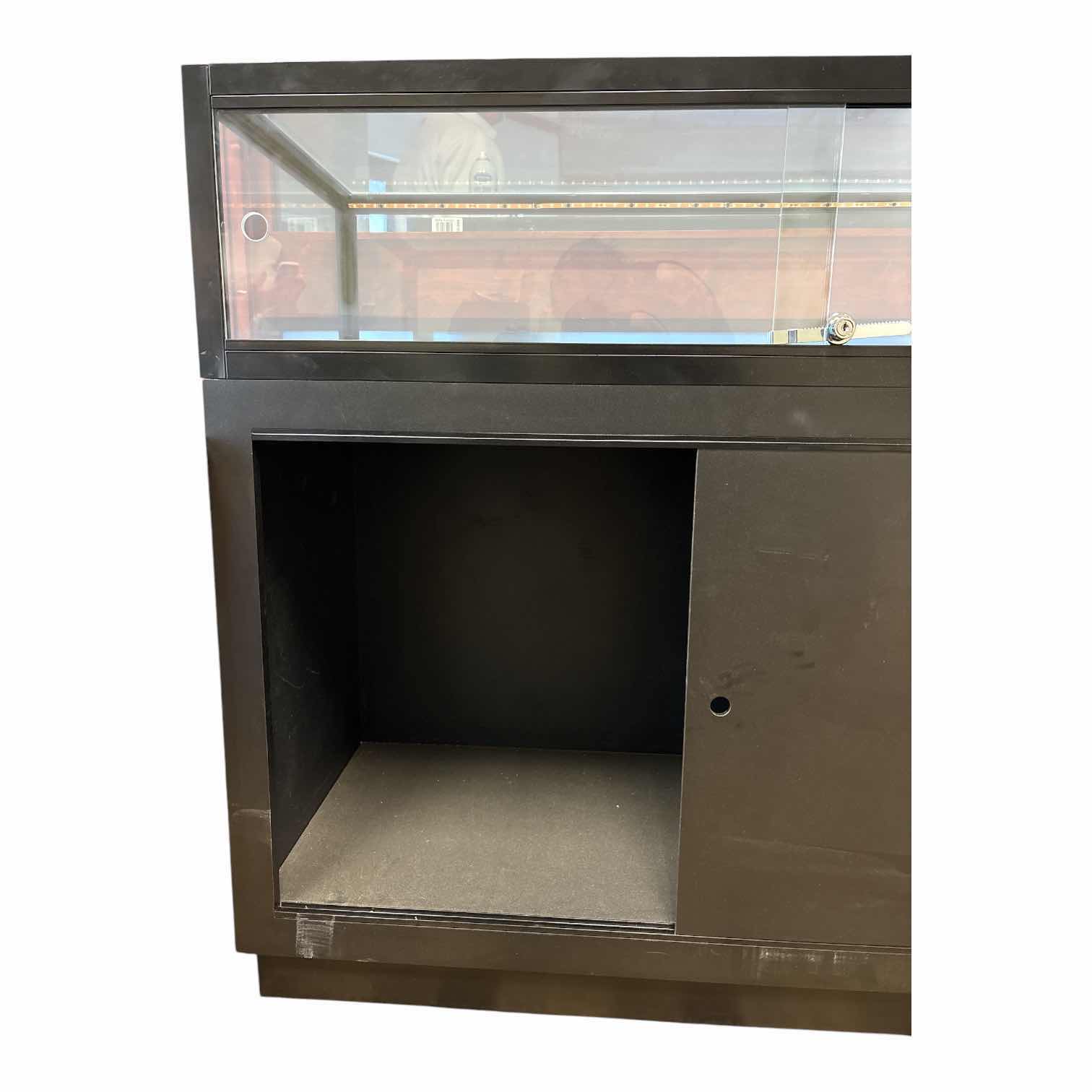 Photo 1 of QUARTER VISION BLACK GLASS DISPLAY COUNTER (SEE NOTES) 49.5”X20”H42”