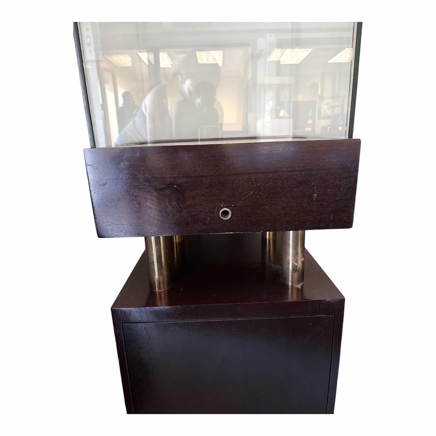 Photo 1 of RETAIL DARK BROWN DISPLAY CASE GLASS ENCASED ON GOLD ACCENT PILLARS 18.25”X18.25”H51.5”