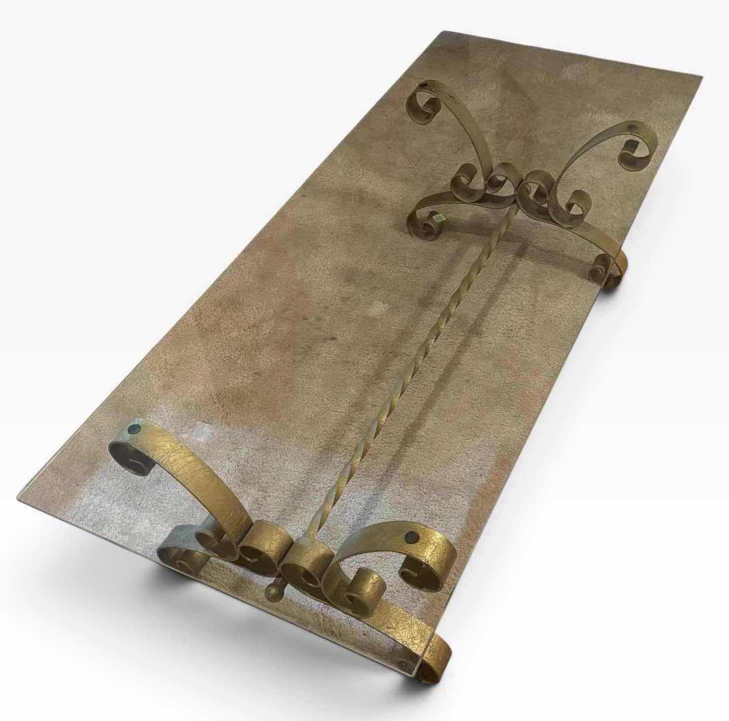 Photo 1 of MID CENTURY MODERN GILT WROUGHT IRON SCROLL HOLLYWOOD REGENCY GLASS TOP COFFEE TABLE IN GOLD FINISH 23.75” X 57.75” H15.25”