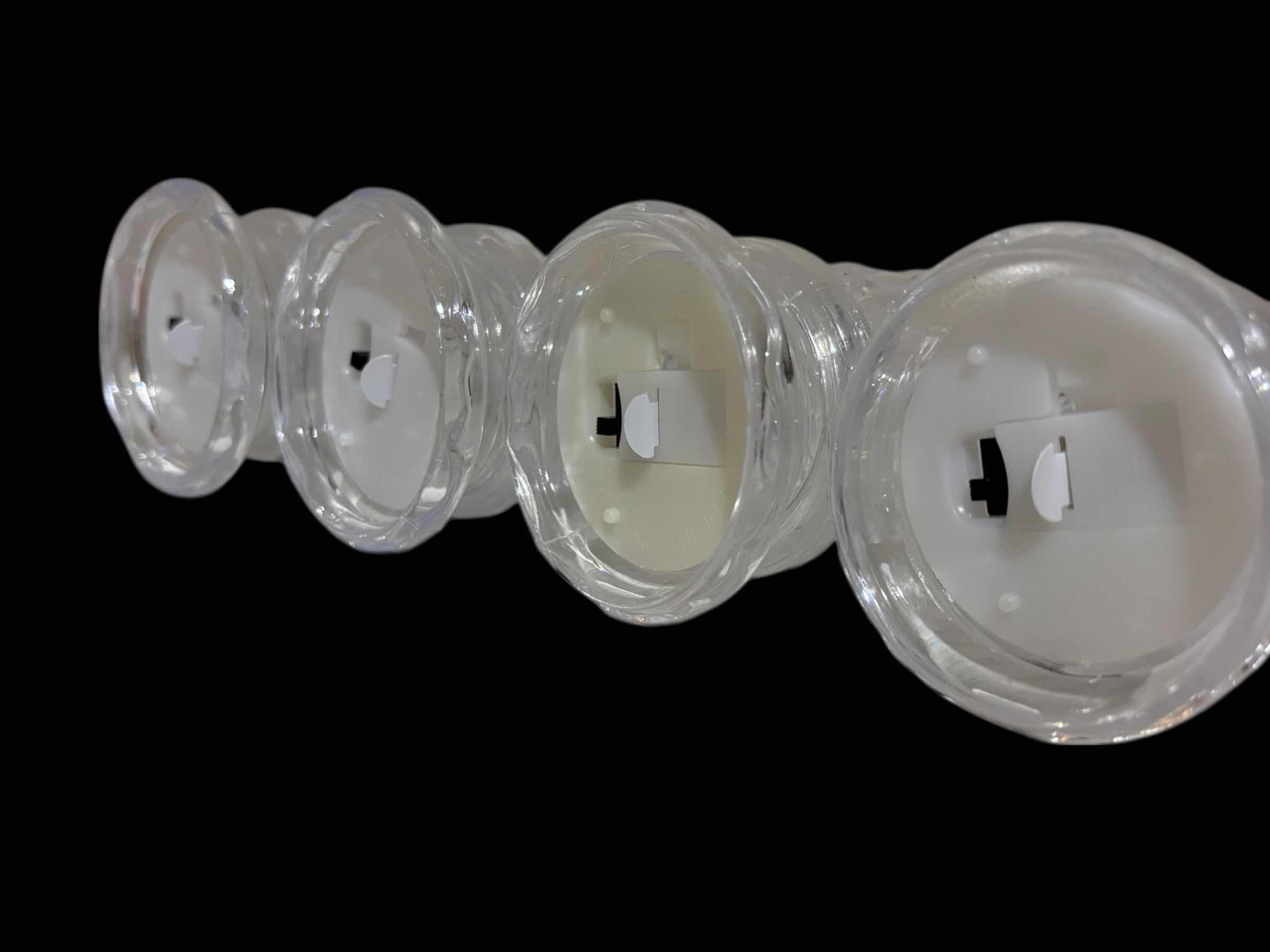Photo 1 of FLAMELESS LED CRYSTAL STYLE PLASTIC CANDLE SET OF 4 W BATTERIES