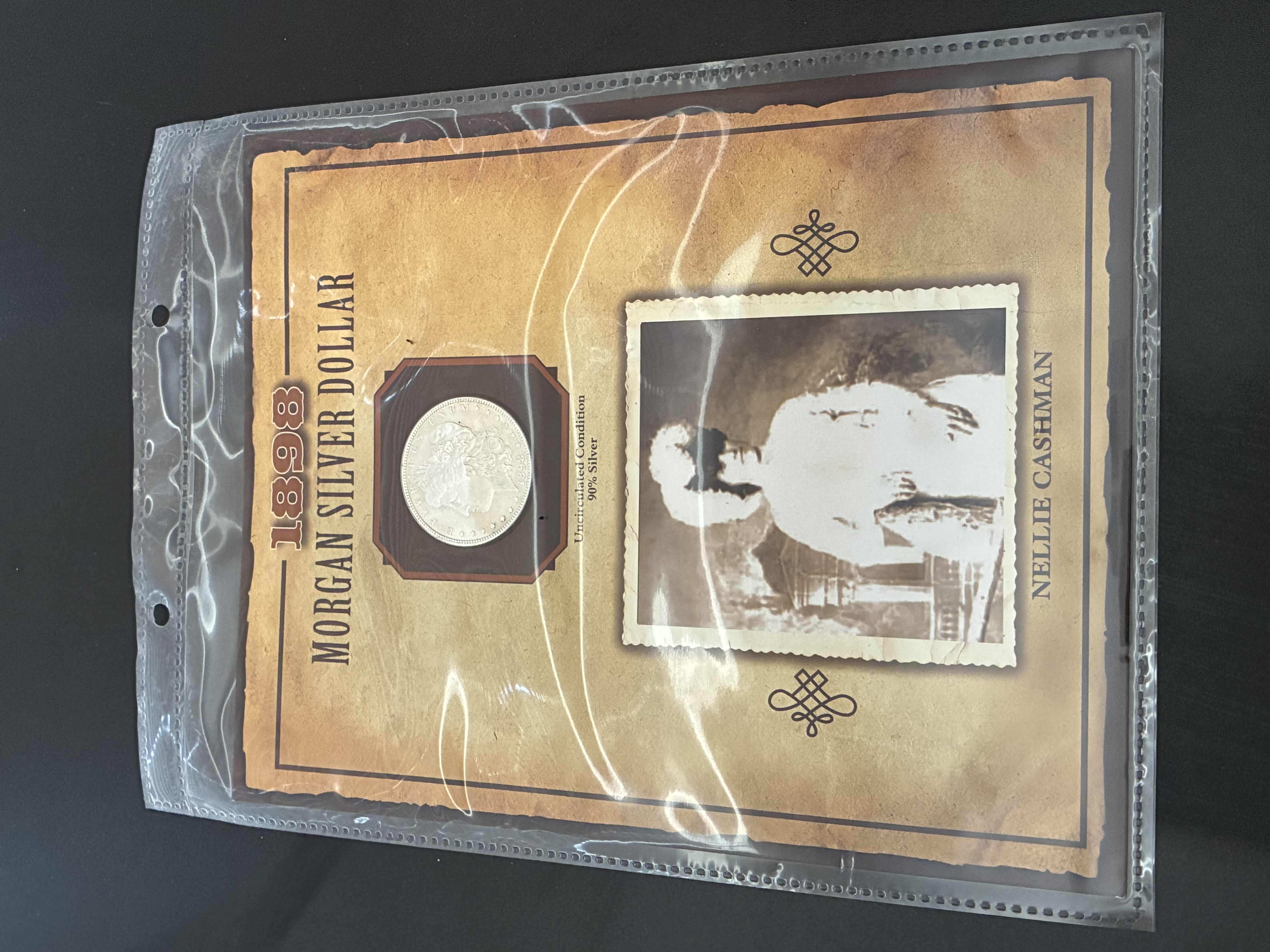 Photo 1 of UNCIRCULATED CONDITION 1898 MORGAN SILVER DOLLAR W NELLIE CASHMAN CARD & SLEEVE $300