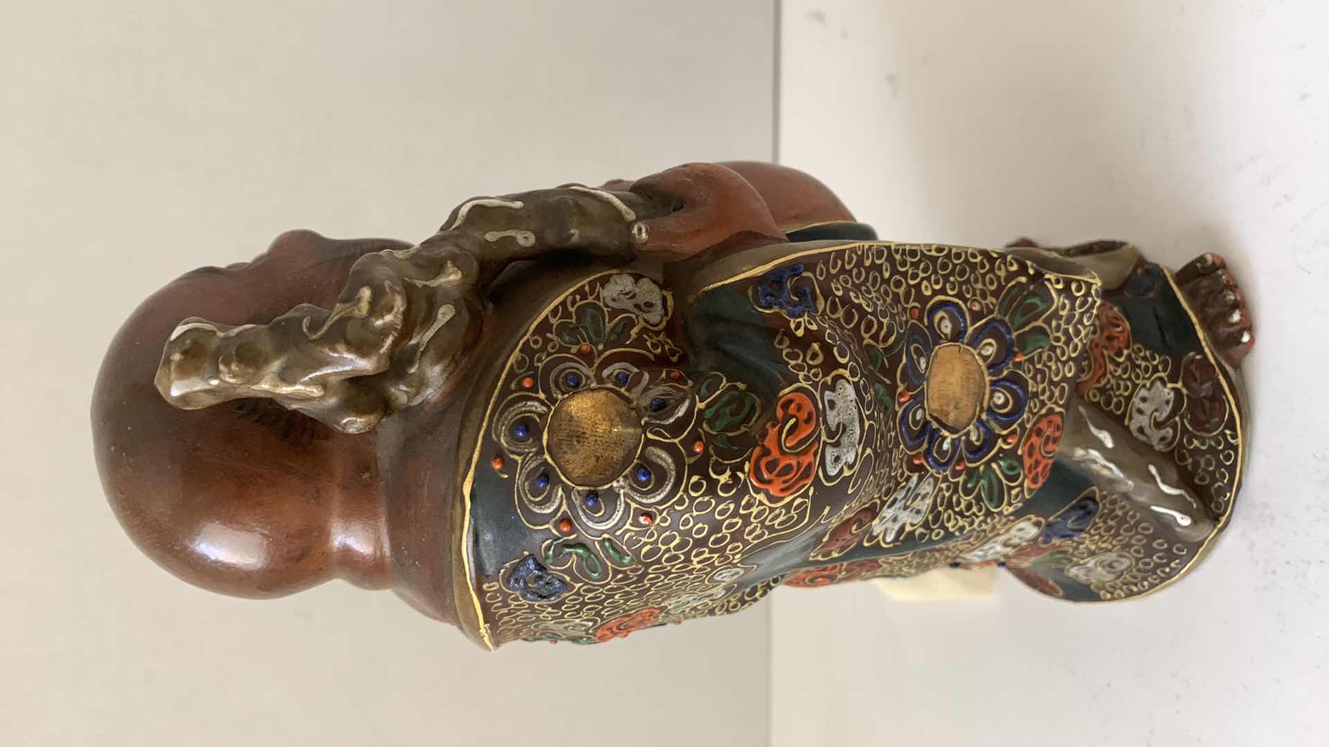 Photo 1 of ANTIQUE KUTANI FIGURE OF HOTEI WITH FLORAL MOTIF MEIJI PERIOD (1868-1912) 9”