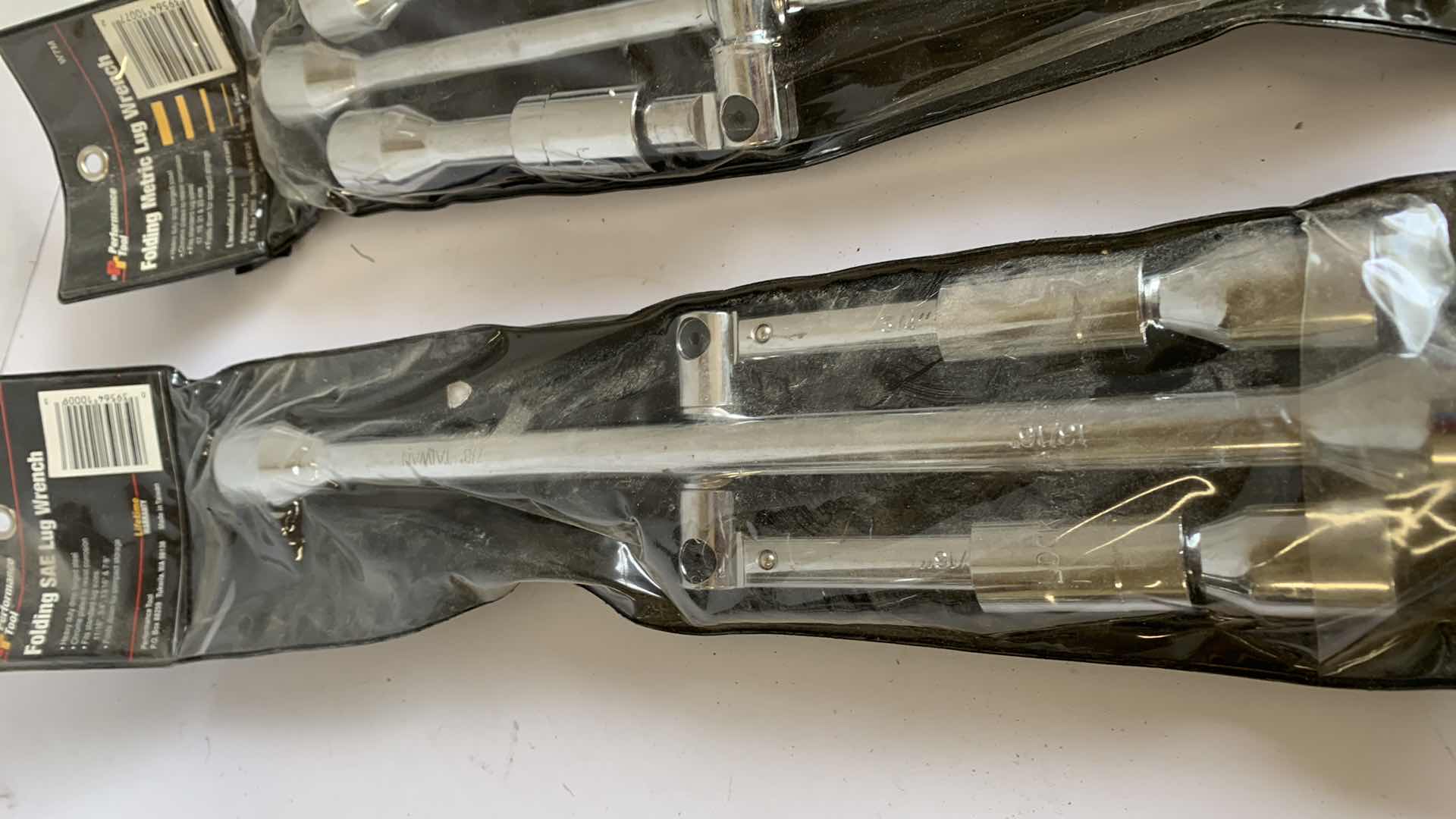 Photo 1 of 2 PERFORMANCE TOOL FOLDING SAE AND METRIC LUG WRENCHES