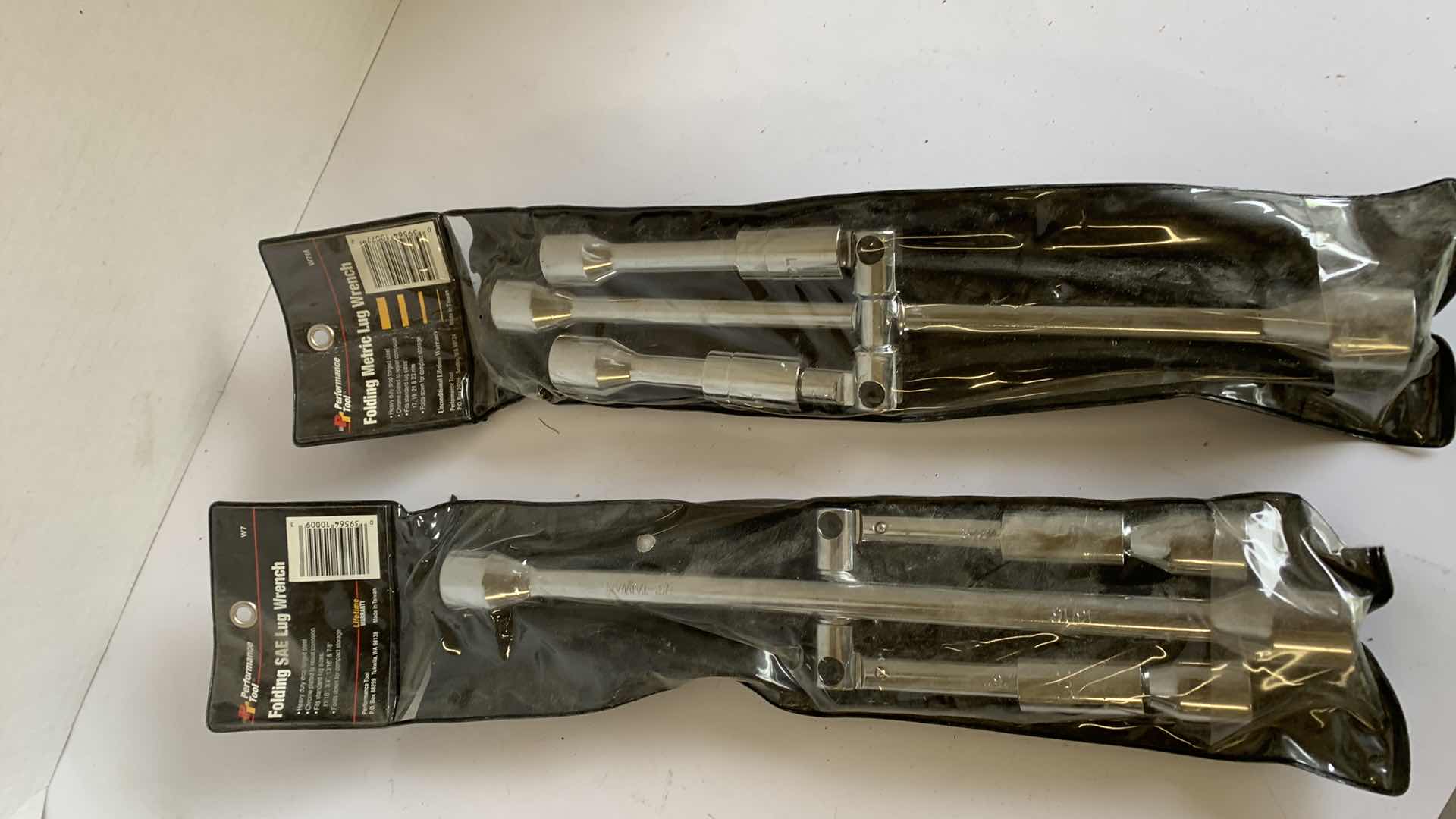 Photo 1 of 2 PERFORMANCE TOOL FOLDING SAE AND METRIC LUG WRENCHES