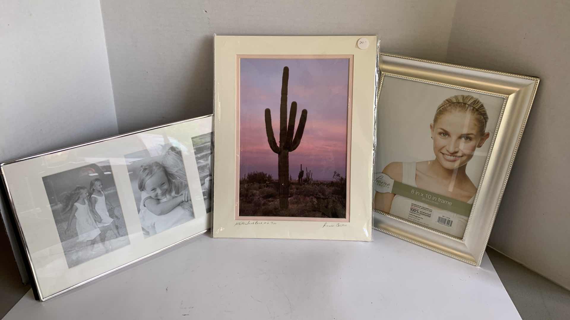 Photo 1 of 2 PICTURE FRAMES AND A FRAMED SIGNED PICTURE