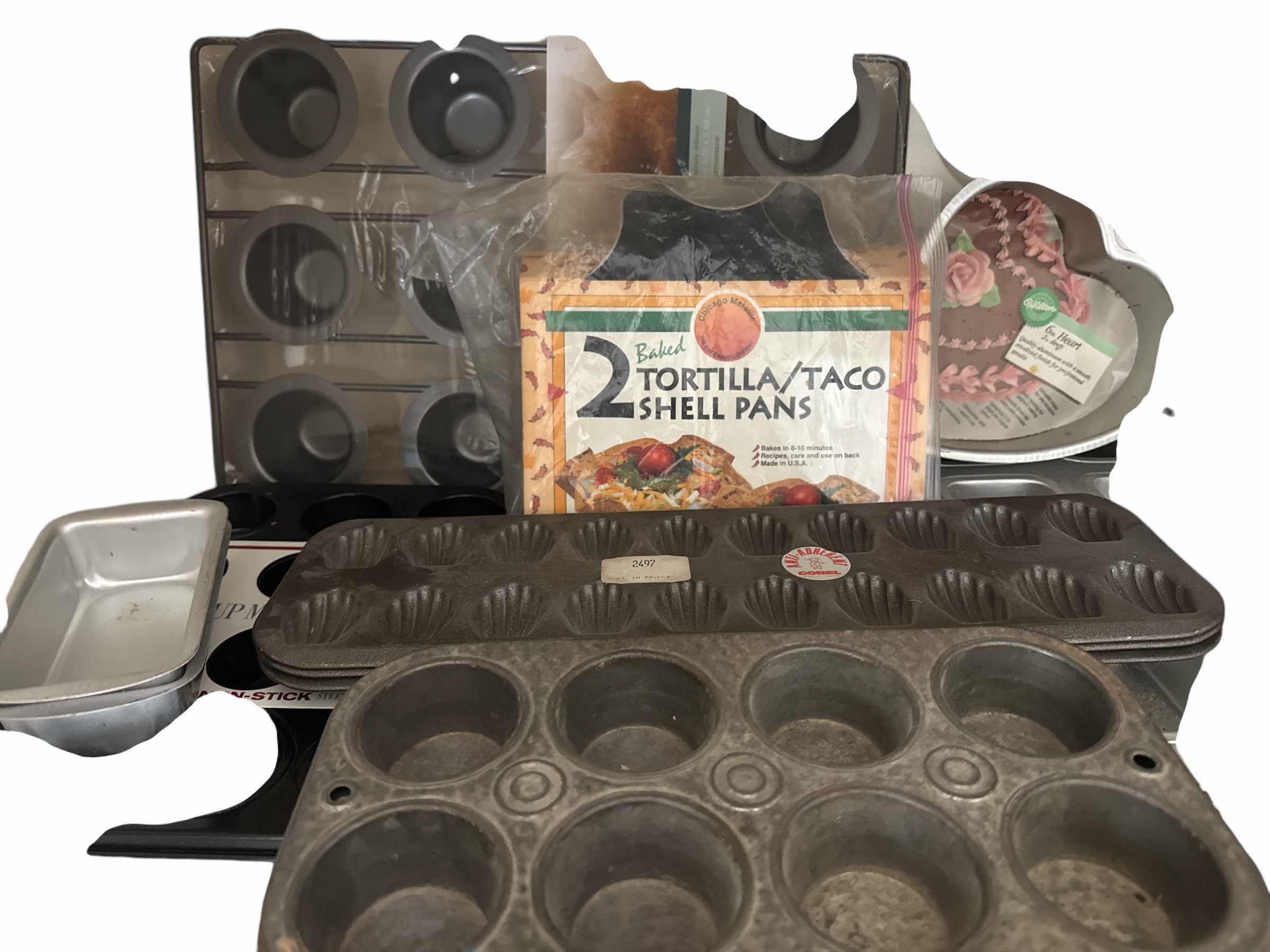 Photo 1 of CONTENTS OF SHELF  (BAKEWARE-MUFFIN PANS AND MOLDS)