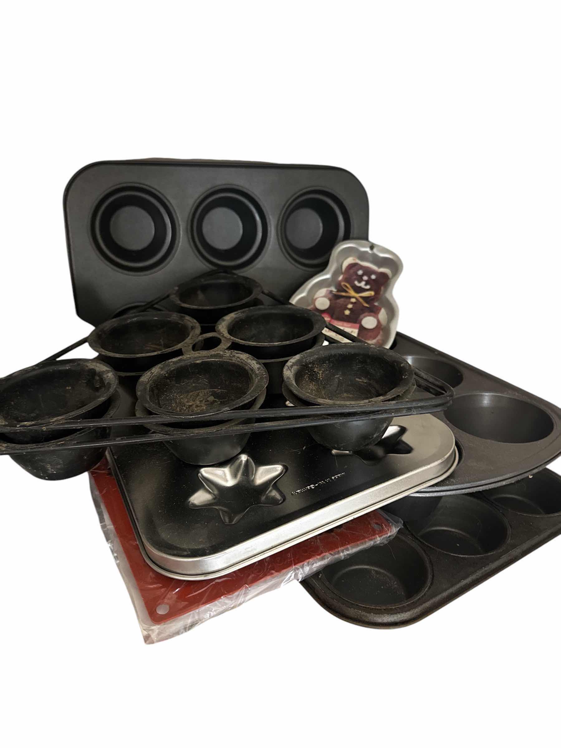 Photo 1 of CONTENTS OF SHELF  (BAKEWARE-MUFFIN PANS AND MOLDS)