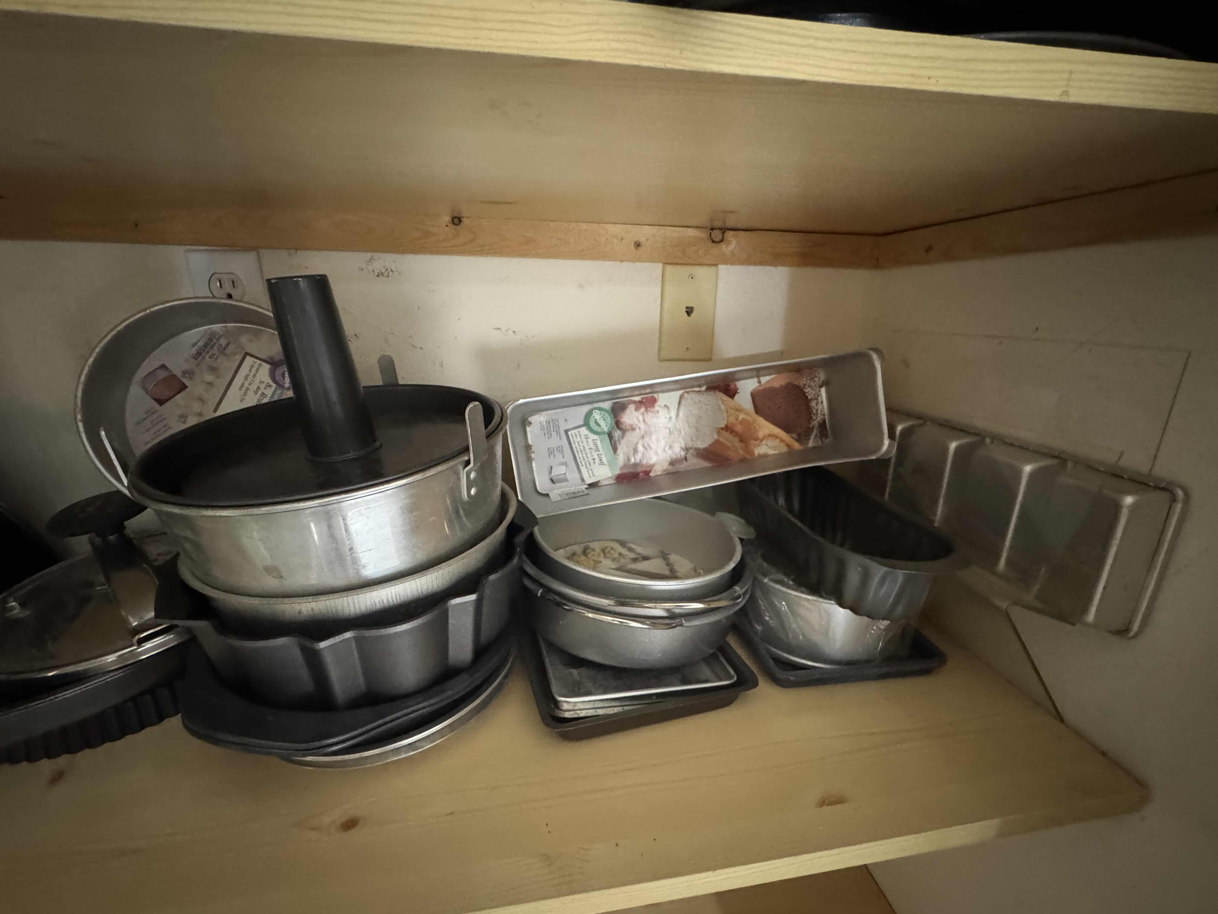 Photo 1 of CONTENTS OF SHELF (BAKEWARE AND MOLDS)