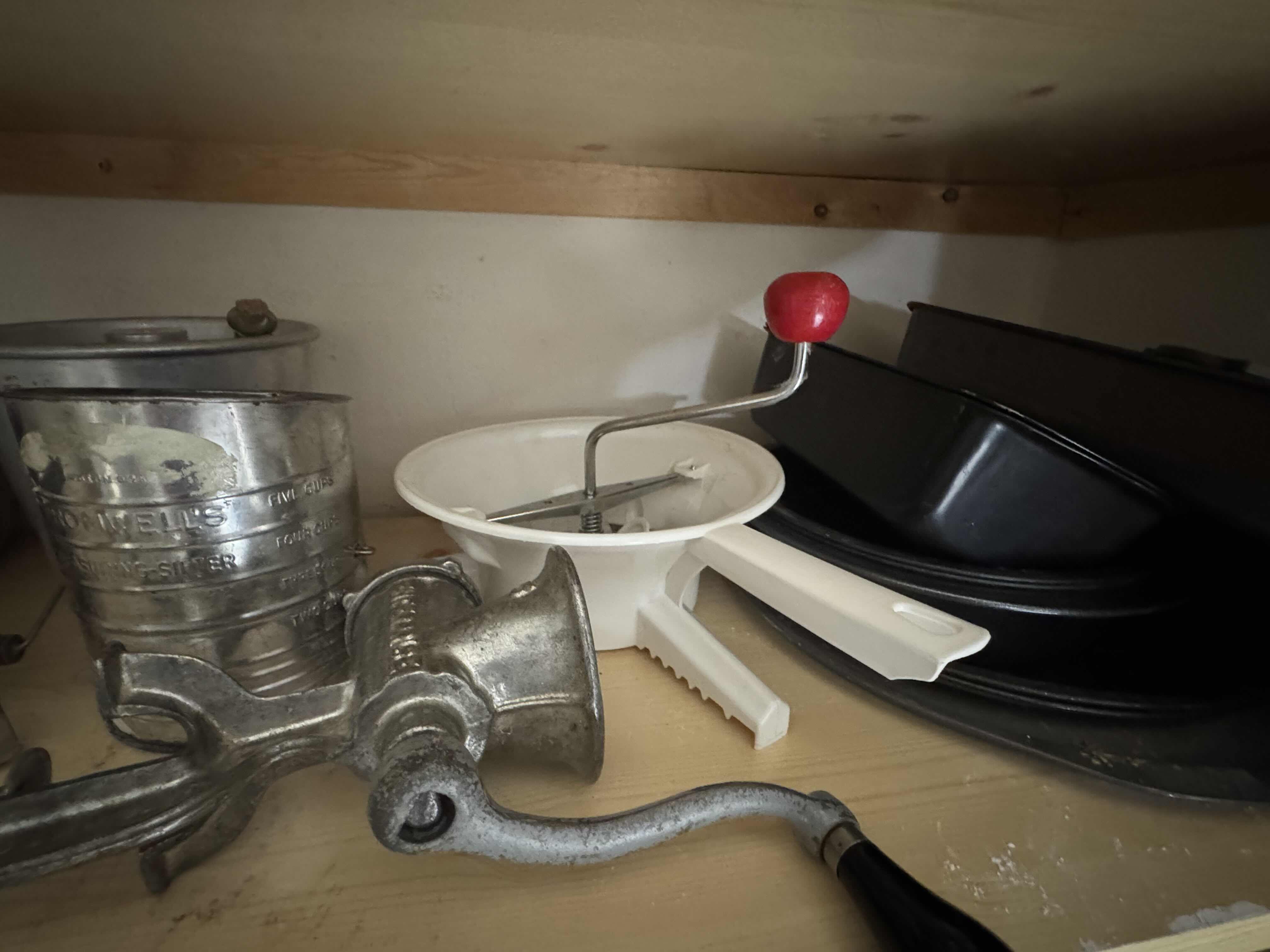 Photo 1 of CONTENTS OF SHELF (SIFTERS, MILLS, GRINDER, BAKEWARE)