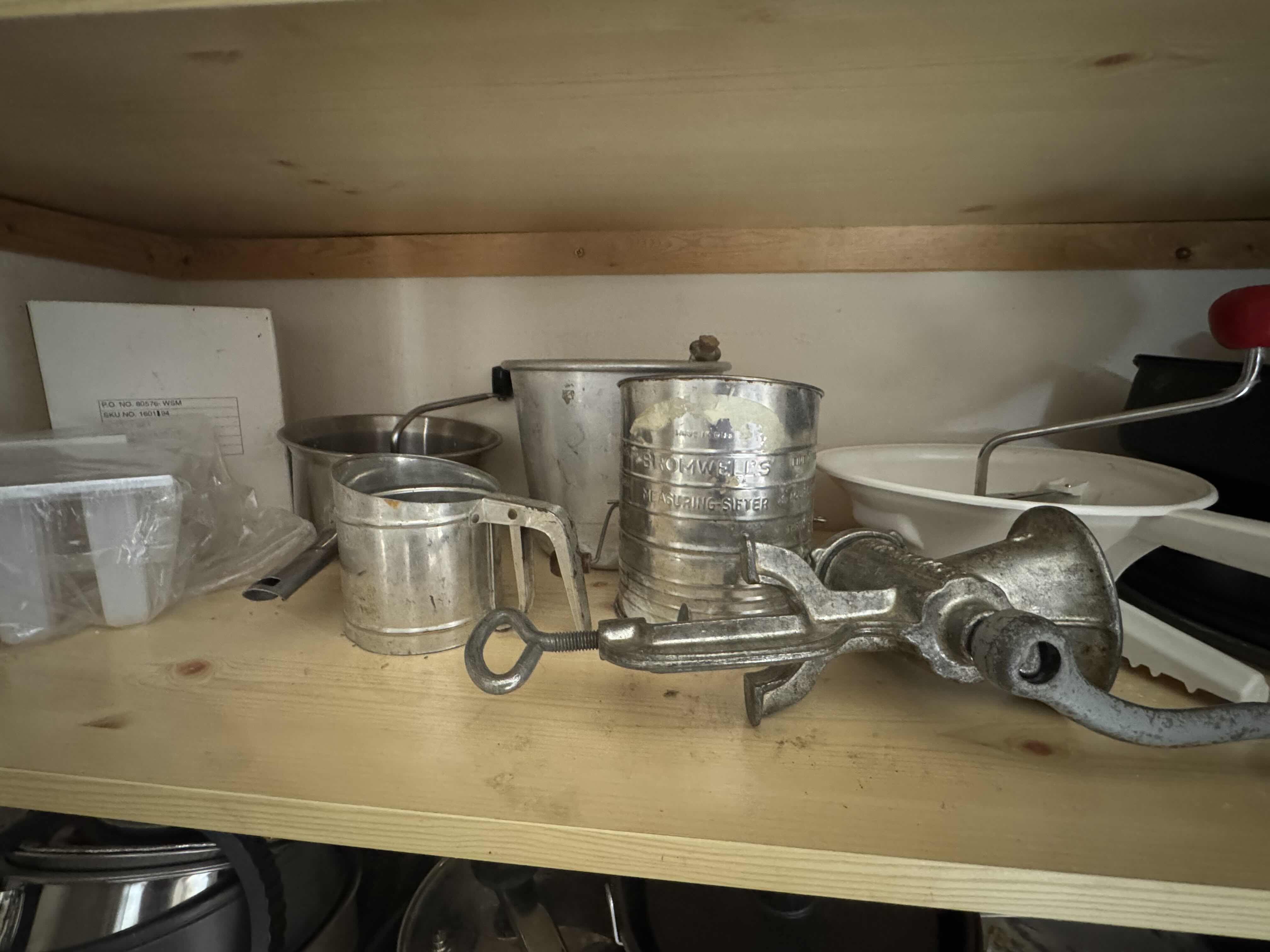 Photo 1 of CONTENTS OF SHELF (SIFTERS, MILLS, GRINDER, BAKEWARE)