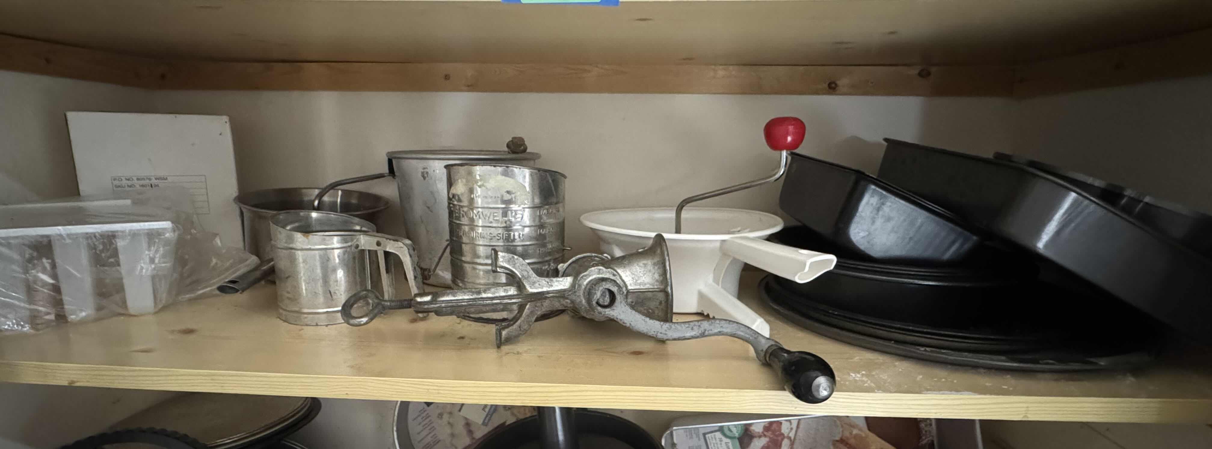 Photo 1 of CONTENTS OF SHELF (SIFTERS, MILLS, GRINDER, BAKEWARE)