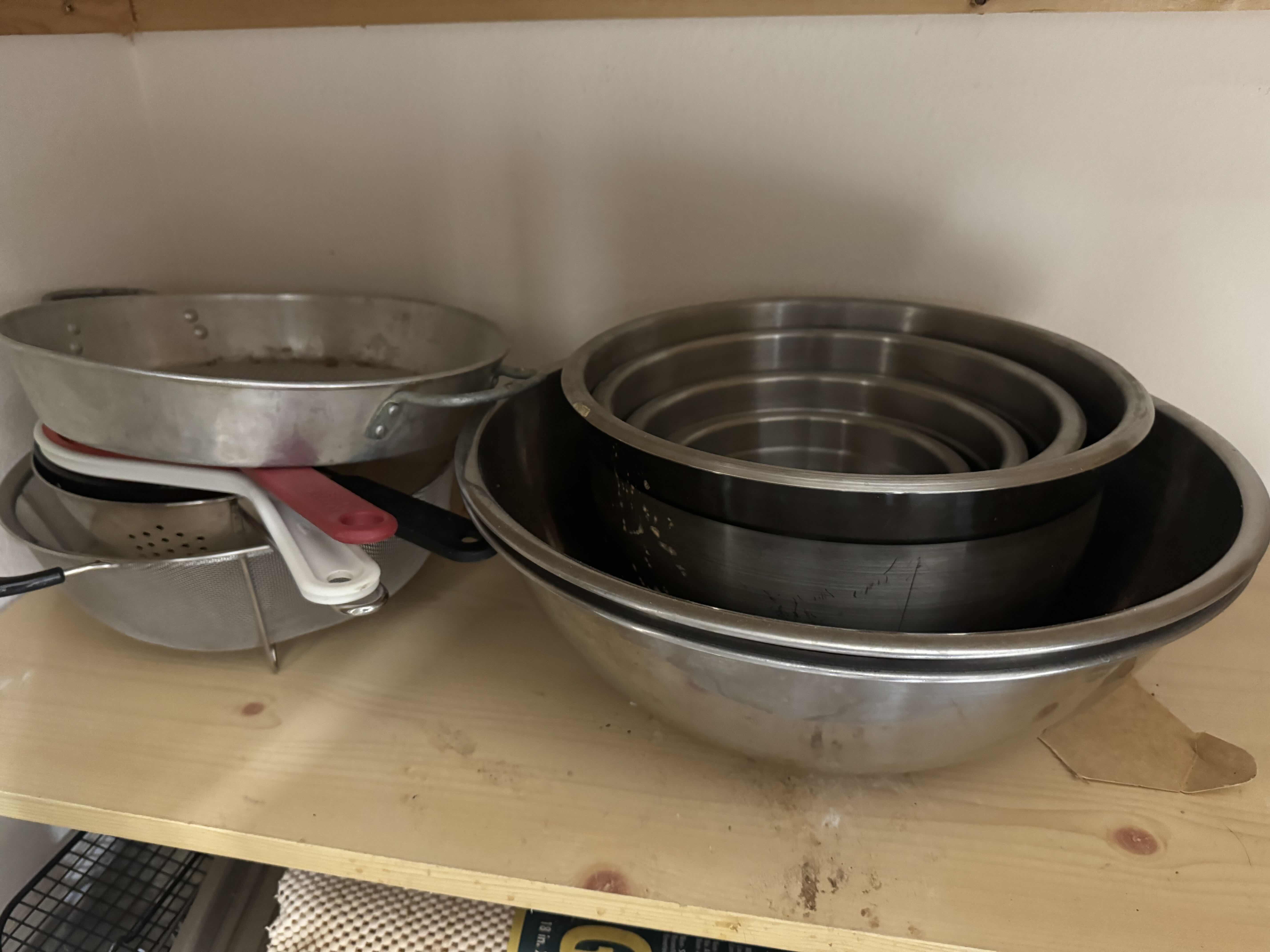 Photo 1 of CONTENTS OF 2 SHELVES- MIXING BOWLS, WIRE RACKS, COOKIE SHEET)