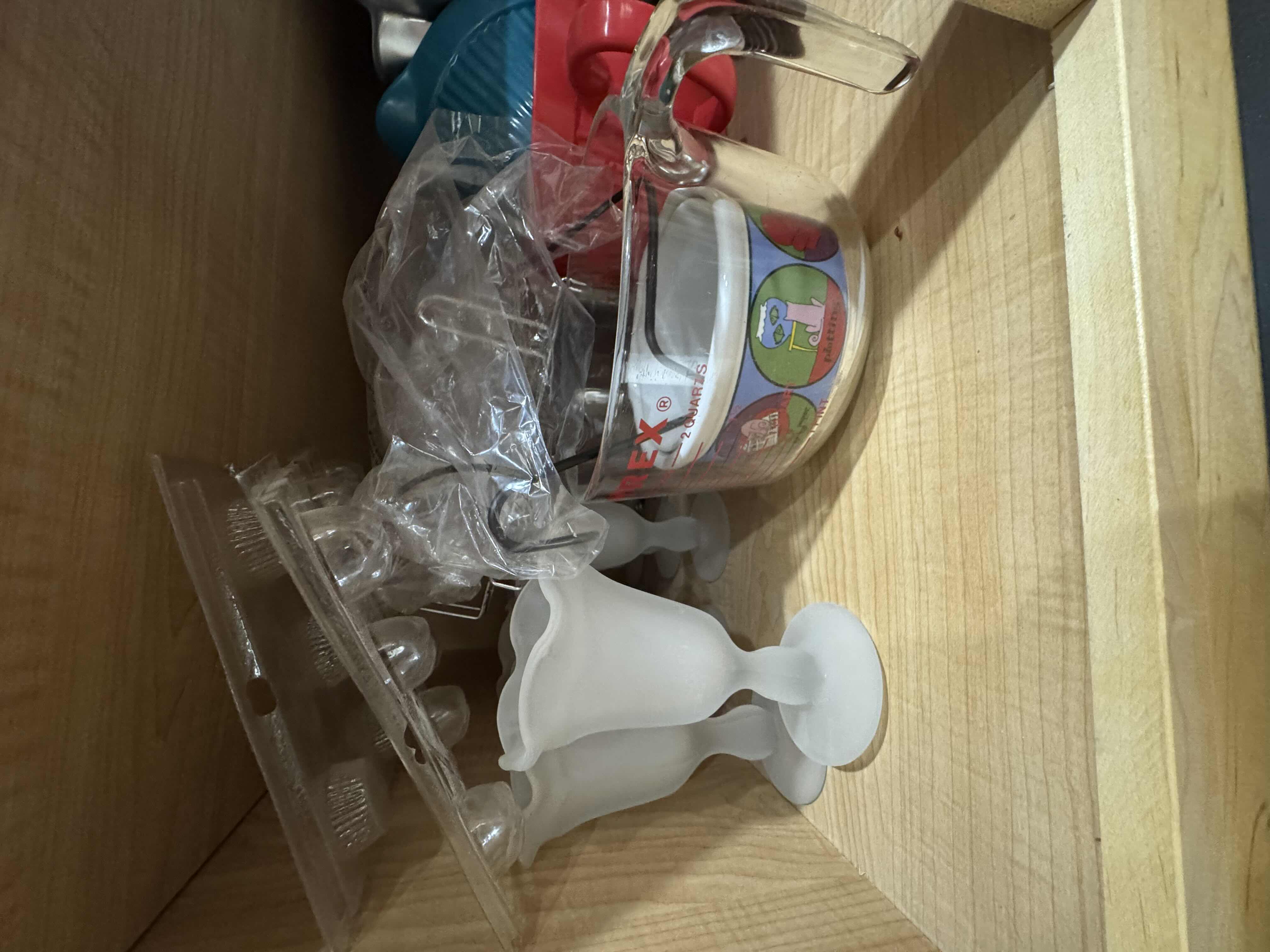 Photo 2 of CONTENTS OF CABINET- BAKING PANS AND MOLDS, GLASSWARE, PITCHER AND PLATES