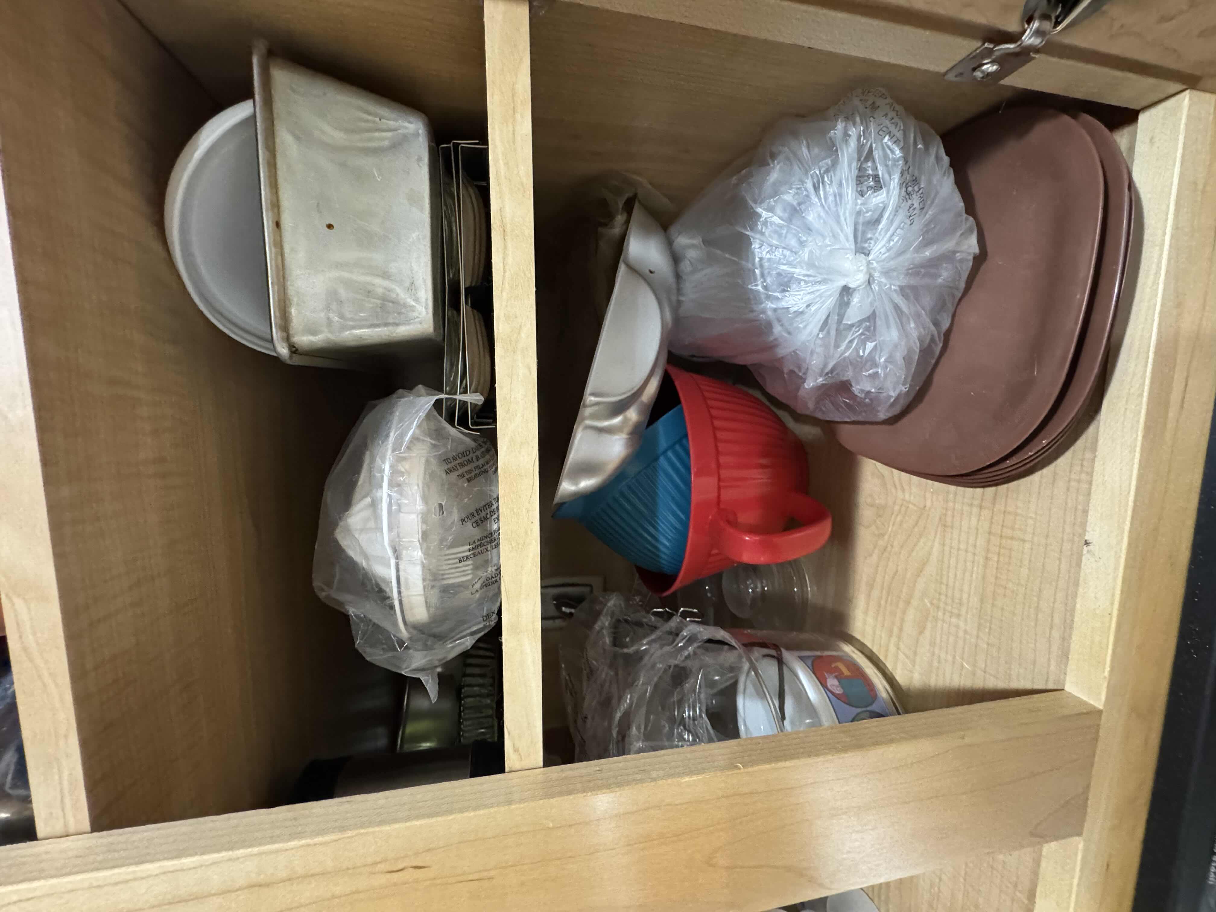 Photo 3 of CONTENTS OF CABINET- BAKING PANS AND MOLDS, GLASSWARE, PITCHER AND PLATES