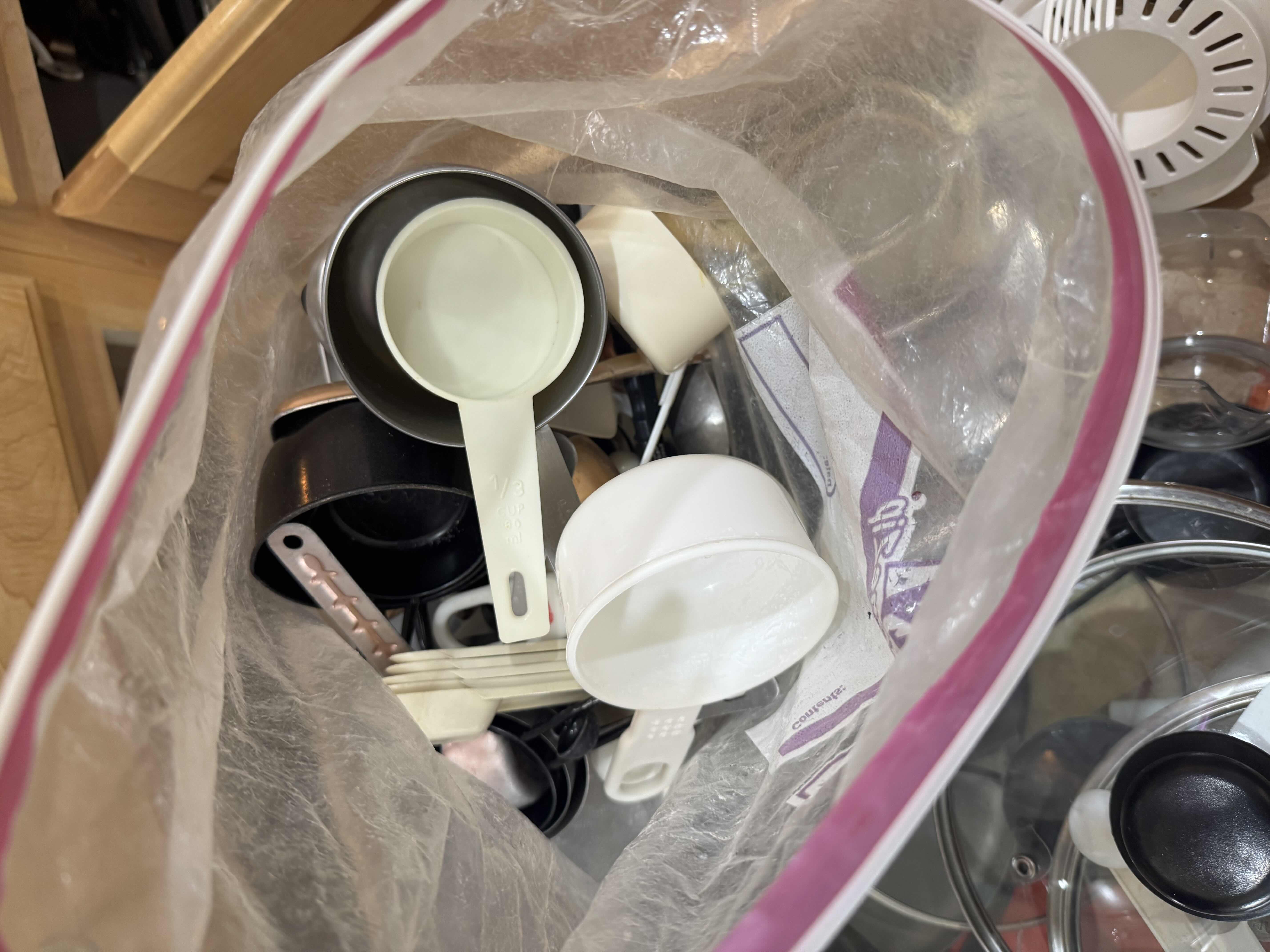 Photo 1 of CONTENTS OF DRAWER- MEASURING CUPS & SPOONS, LIDS, BASTING BRUSH, JUICER