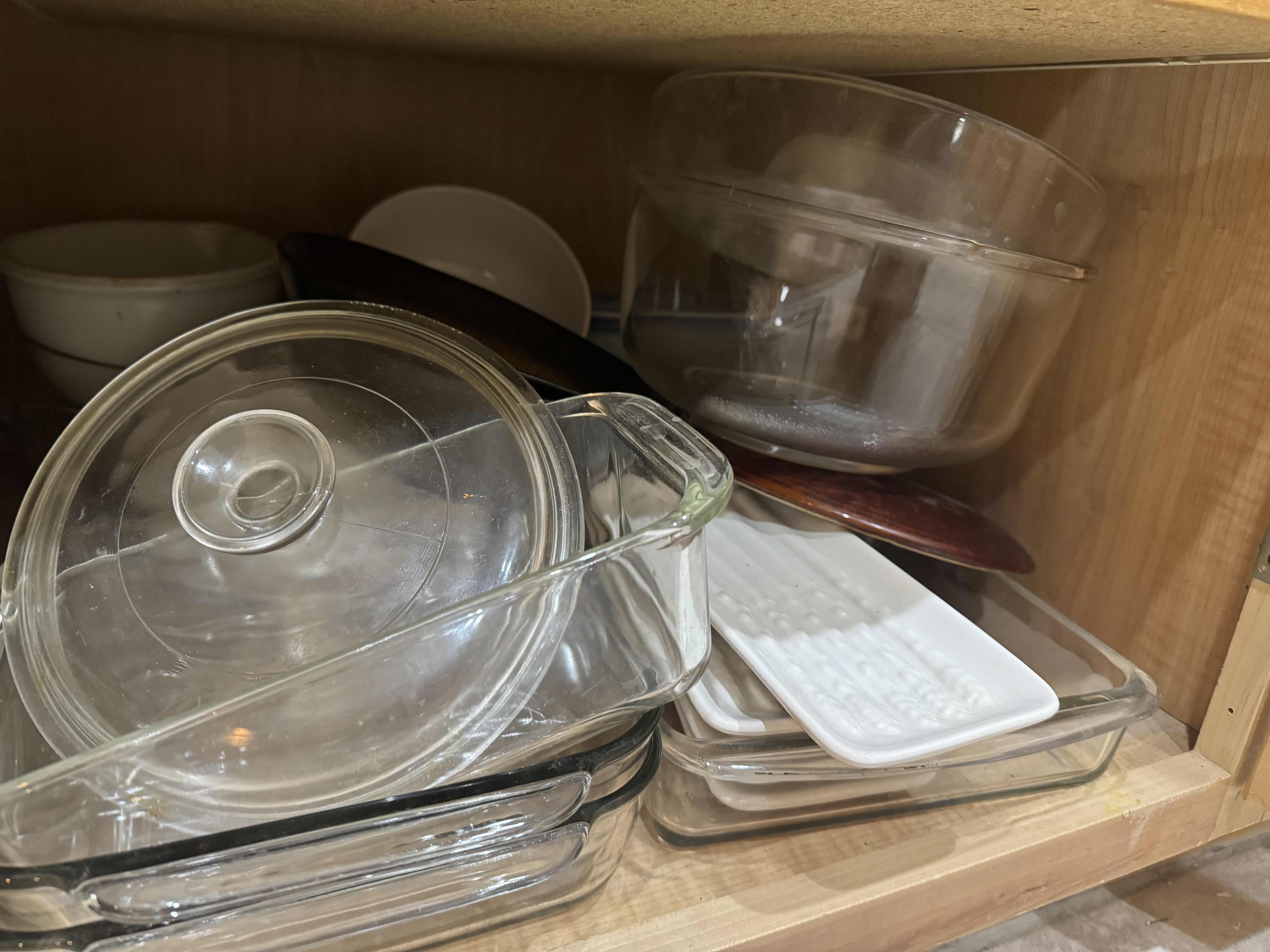 Photo 1 of CONTENTS OF RIGHT CABINET- SALAD PLATES, PYREX, LIDS