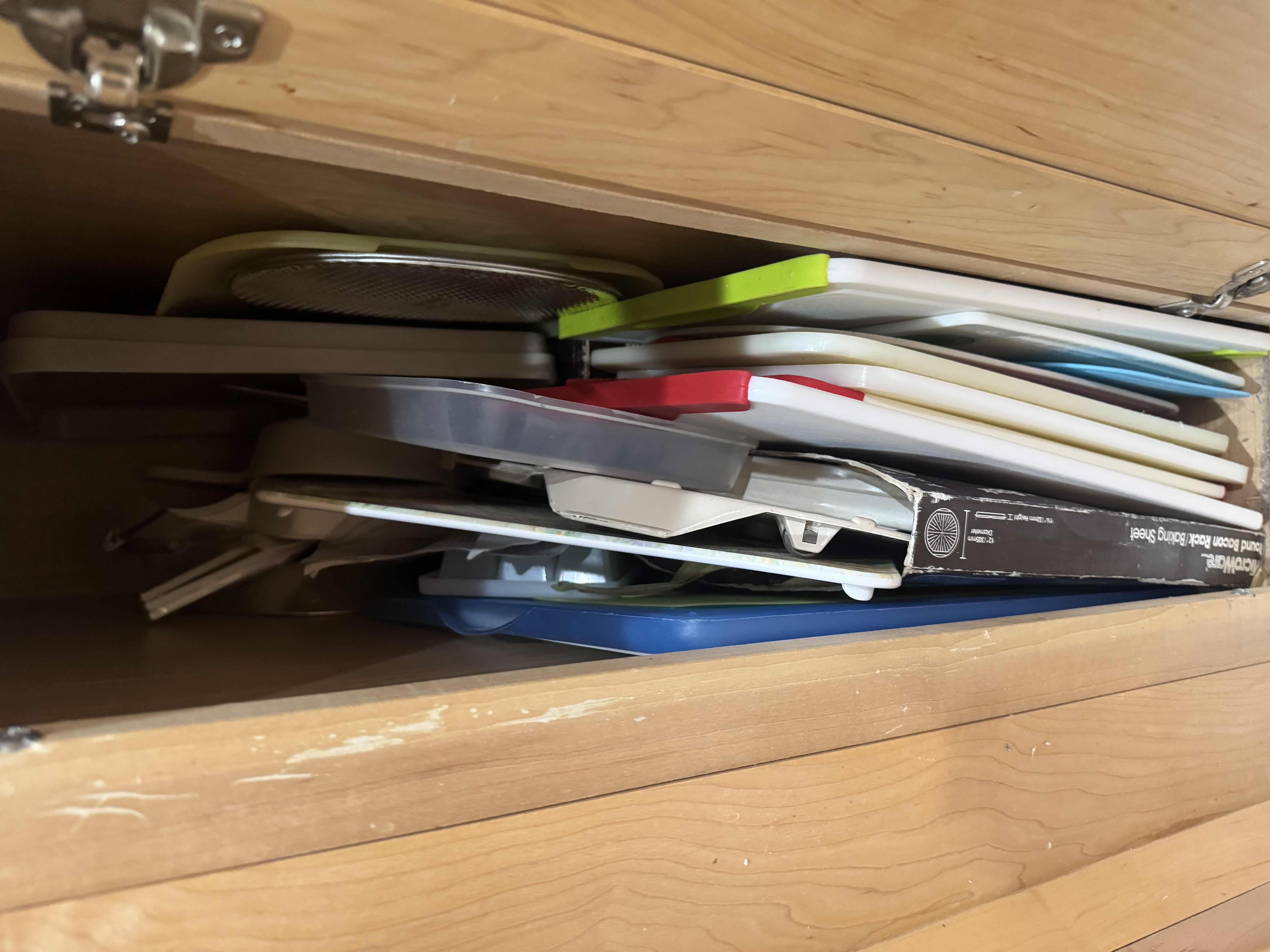 Photo 1 of CONTENTS OF CABINET-CUTTING BOARDS, MICROWAVE BACON RACK