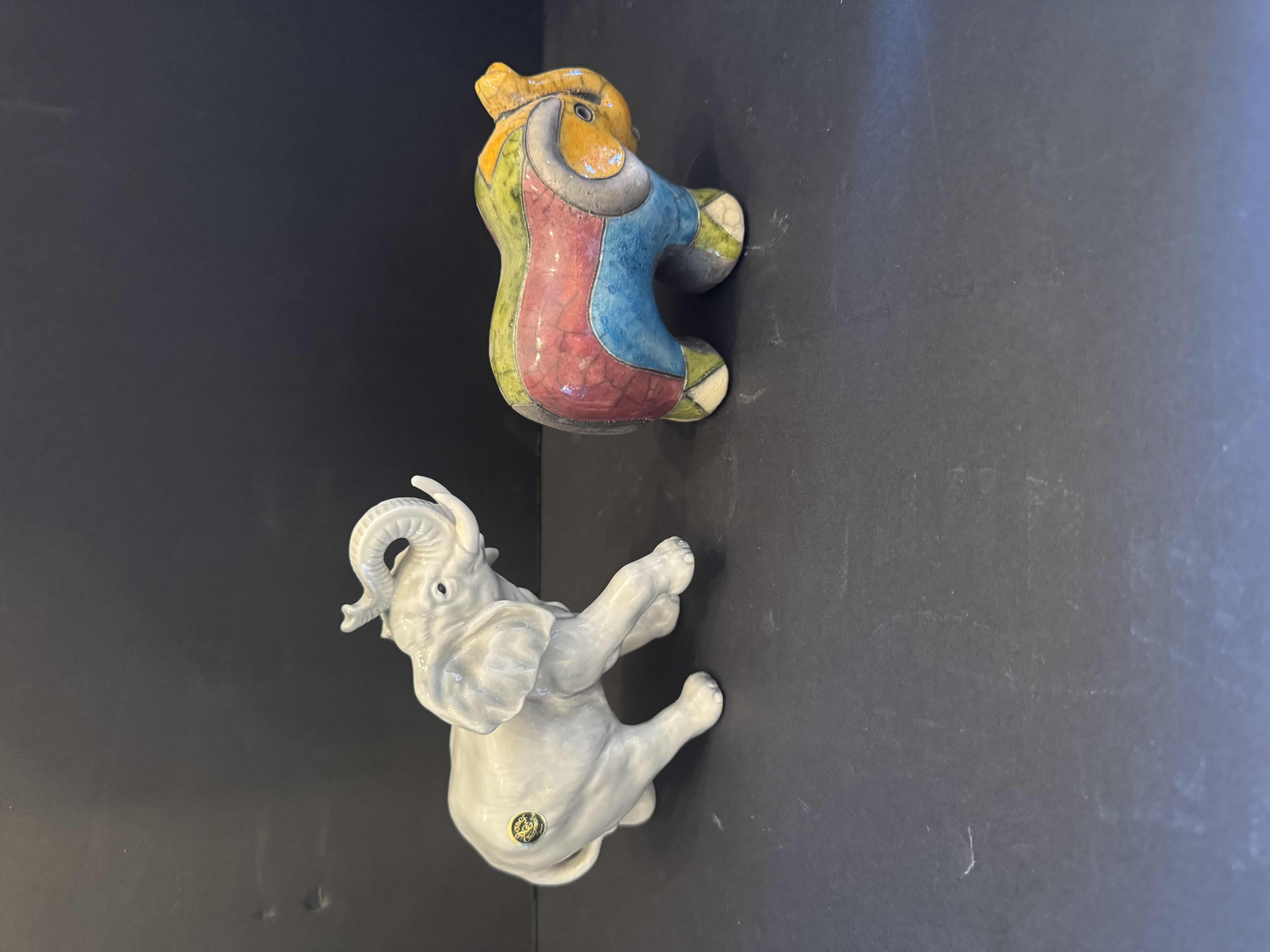 Photo 2 of 5- VINTAGE ELEPHANT FIGURINES, CERMAIC, PORCELAIN, AND RESIGN
5” X 7”H 
6”X 5”H
4.5” X 4”H
4” X 4”H 
5.5” X 4”H