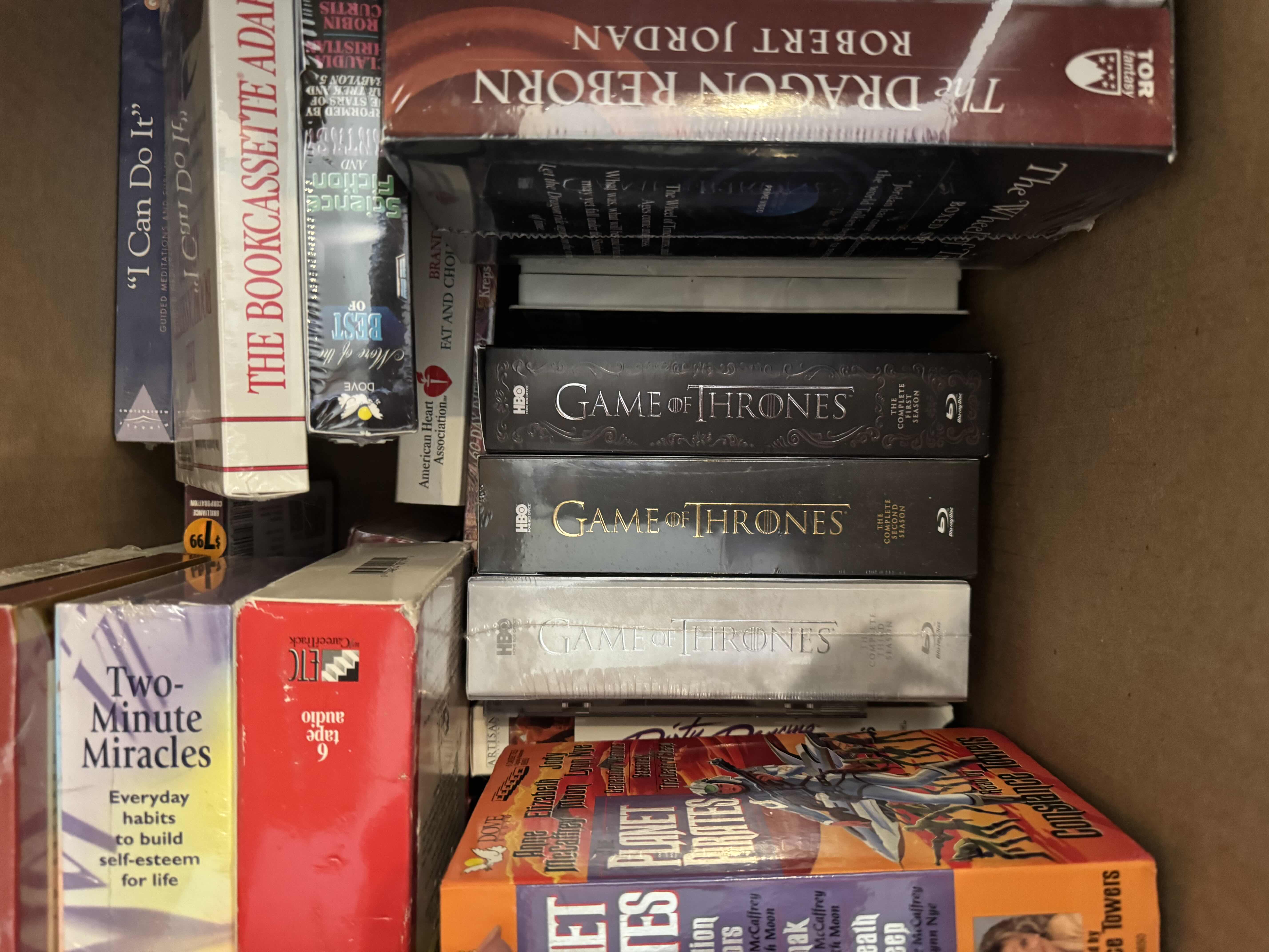 Photo 1 of BOX OF ASSORTED MEDIA, AUDIO BOOKS, BOOKS, BLU-RAY, VHS, AND CASSETTES