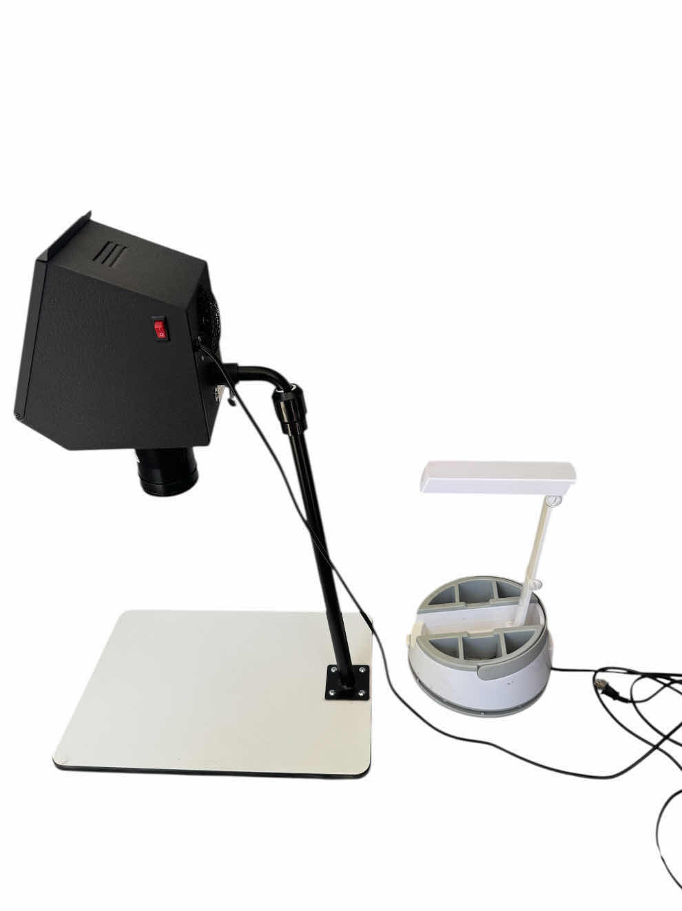 Photo 1 of KOPYRITE ADJUSTABLE PROJECTOR, ARTWORK PROJECTOR, BLACK/WHITE, AND DESK LAMP L, CRAFTING LAMP, LAMP WITH STORAGE, WHITE PROJECTOR. 20” X 14” X 31”