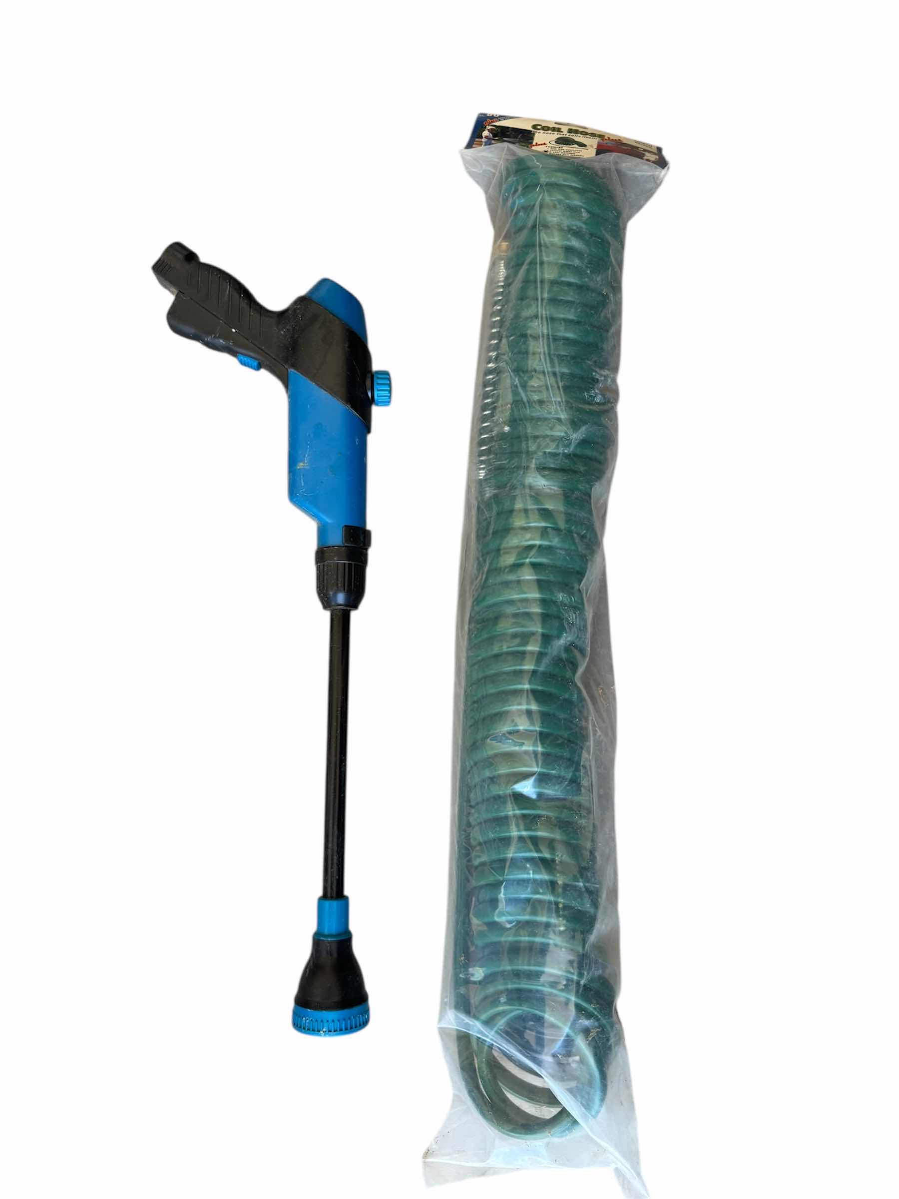 Photo 1 of 50” GREEN COIL HOSE AND WATER SPRAY GUN, OUTDOOR AND GARDENING