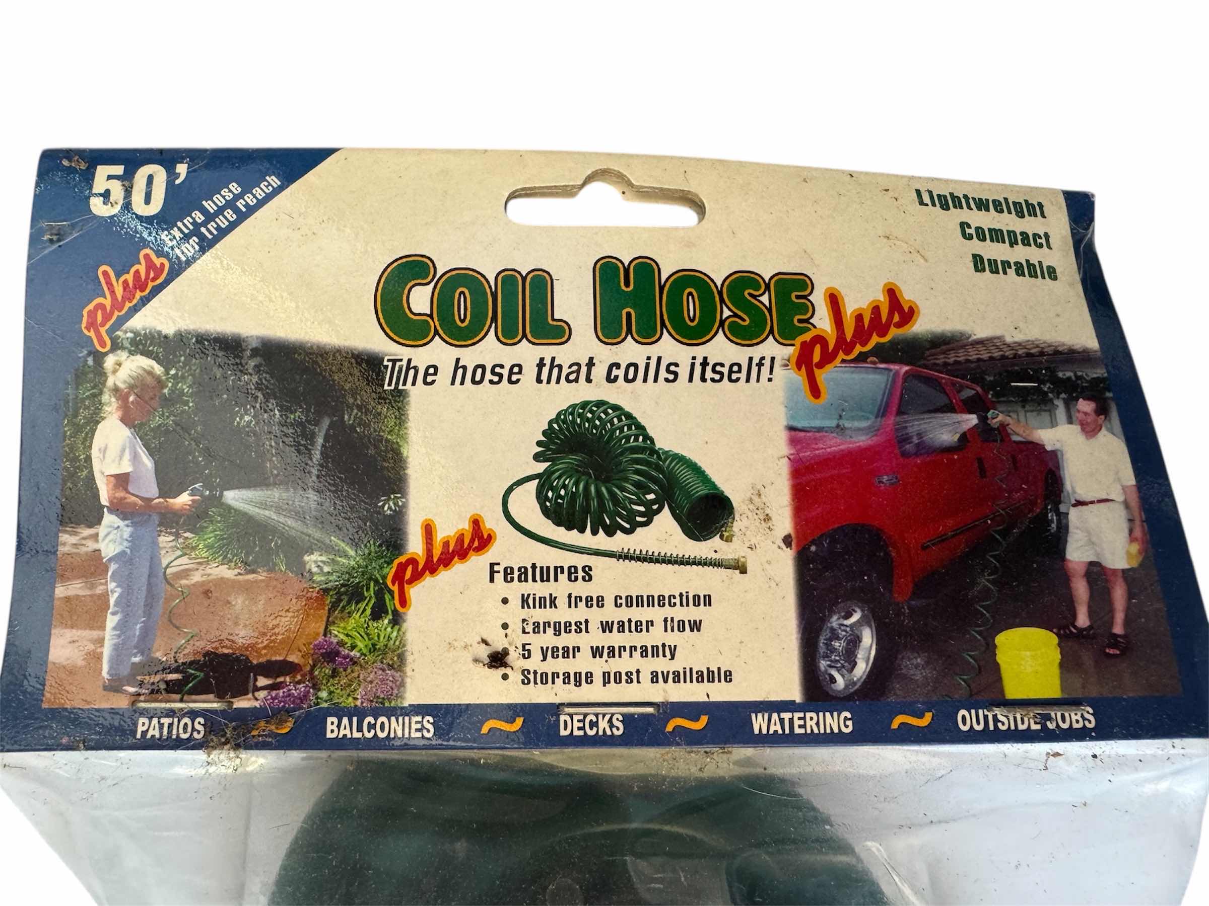 Photo 1 of 50” GREEN COIL HOSE AND WATER SPRAY GUN, OUTDOOR AND GARDENING