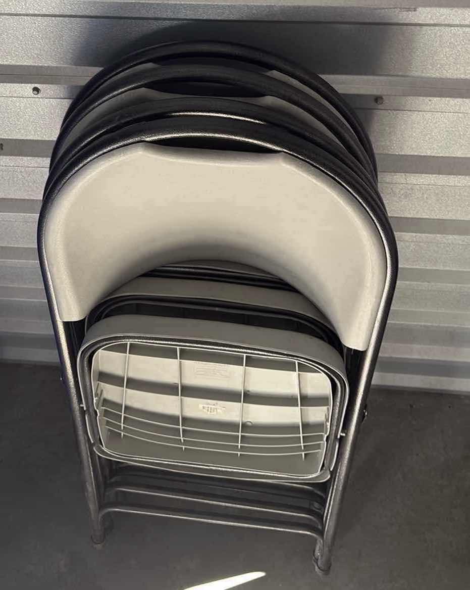 Photo 1 of FOUR PLASTIC FOLDING CHAIRS GRAY